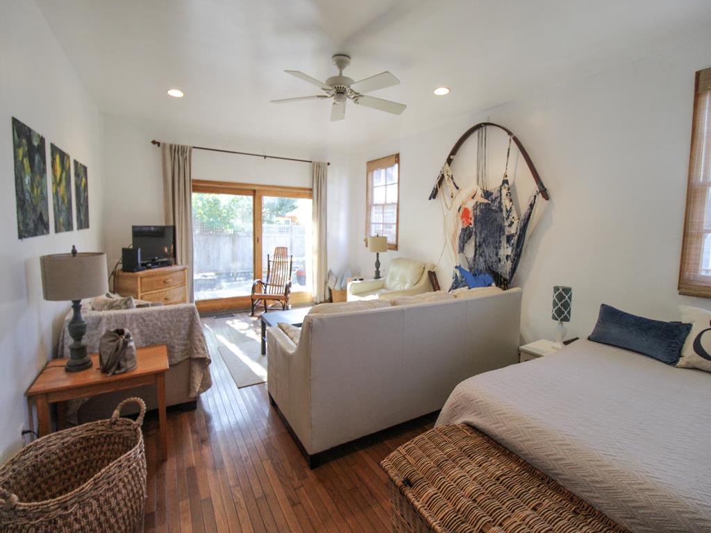 image Spacious and sunny family room with a queen daybed and cozy seating for movie nights or afternoon naps.
