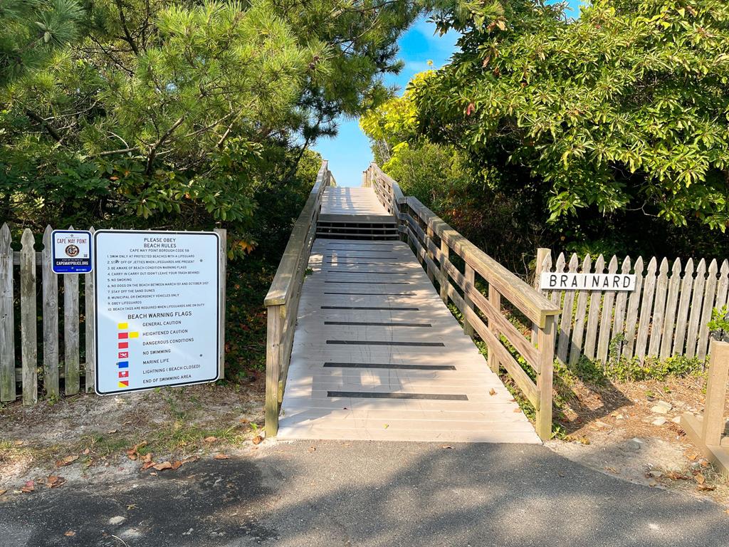 image Beach path just steps away for daily seaside adventures.