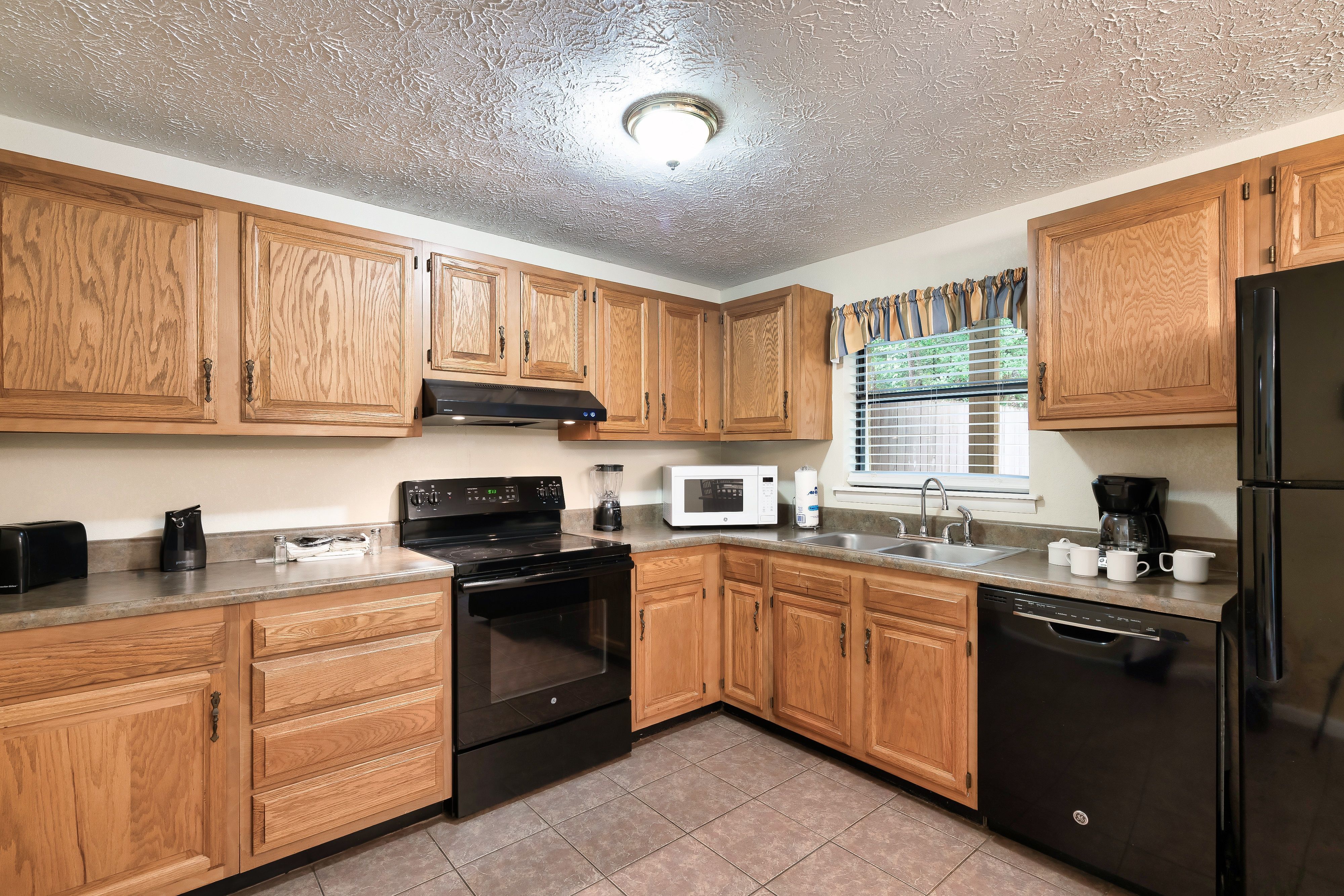 image Whip up family favorites in the fully equipped kitchen with modern appliances and plenty of counter space.