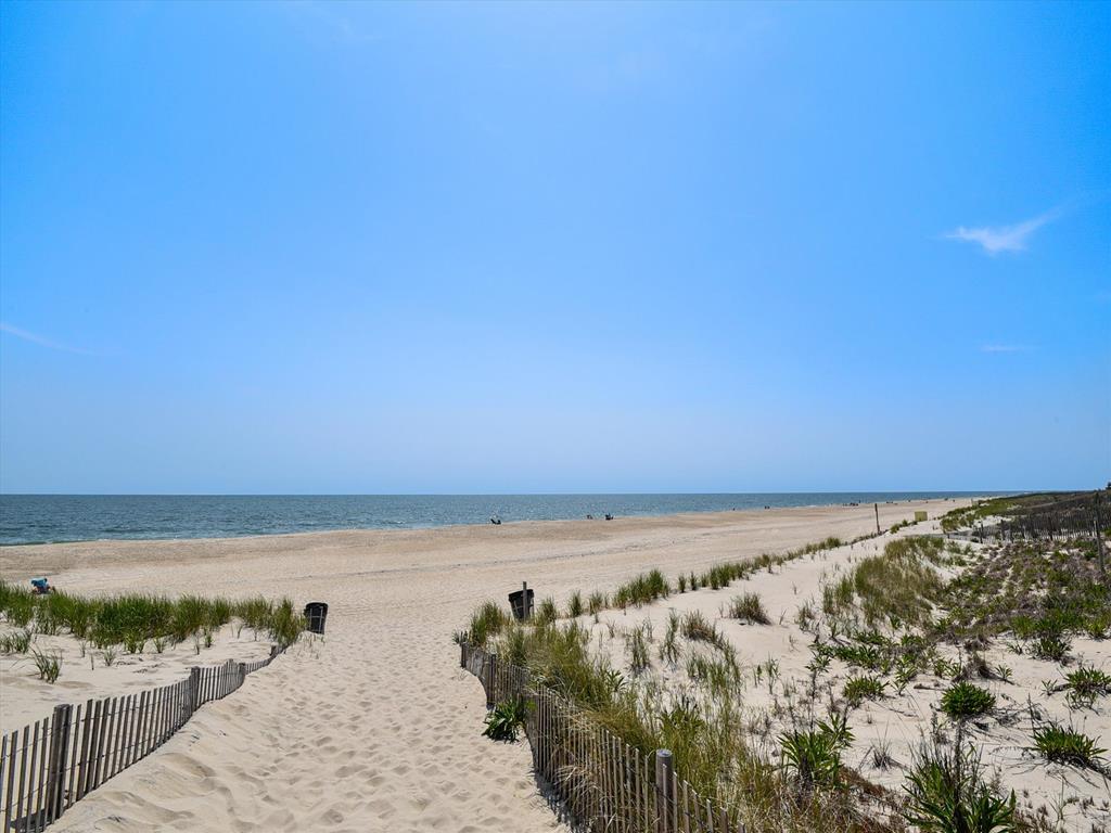 image Feel the warmth of the sun as you stroll along the wide, inviting beach.