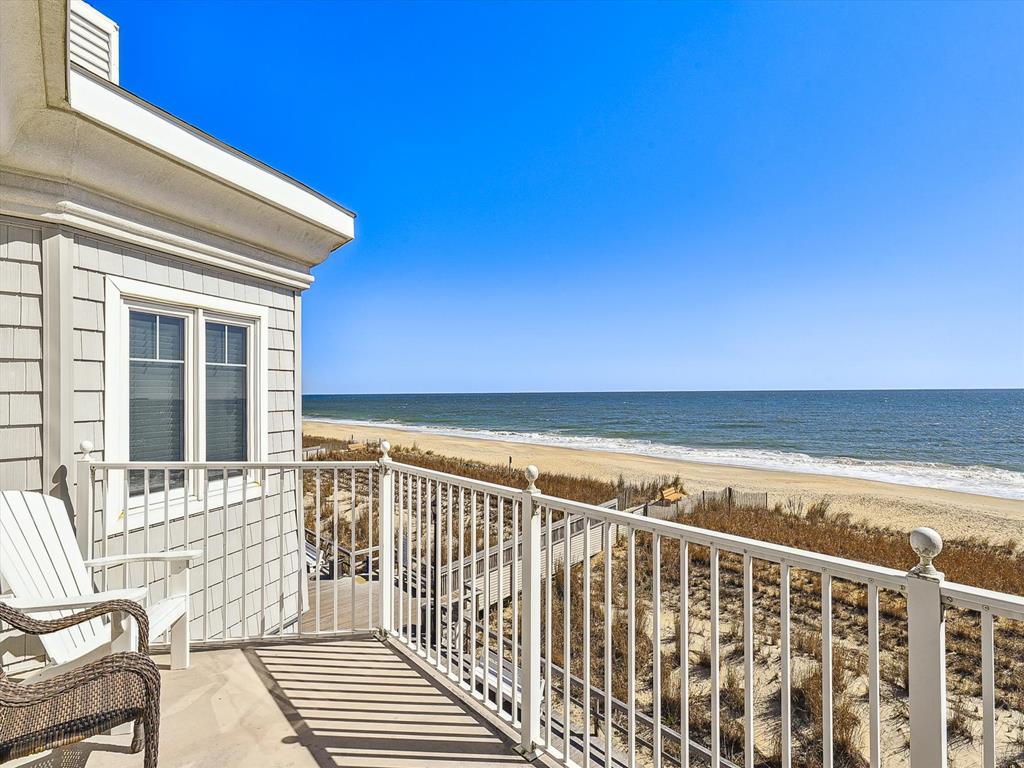 image The private deck invites you to unwind while enjoying breathtaking ocean vistas and the gentle sound of waves.