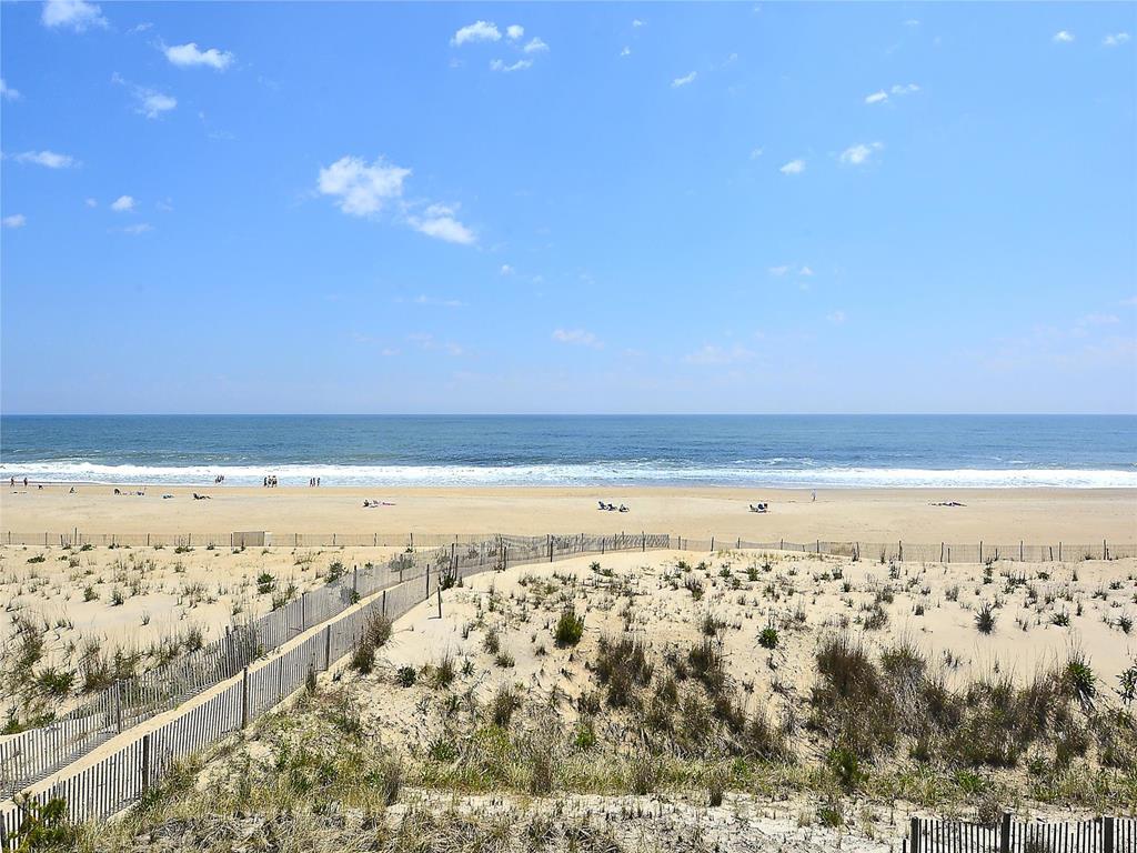 image Enjoy a peaceful view of the shoreline, perfect for a day of sunbathing and beach walks.