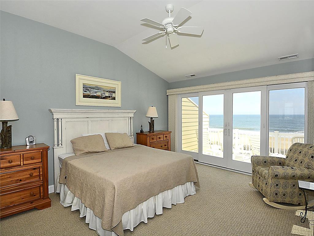 image Unwind in this serene bedroom, where natural light dances on the walls.