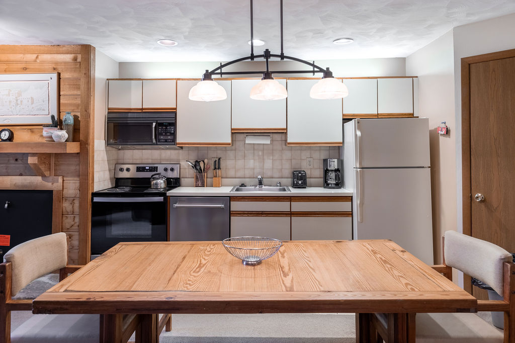 image Open dining and kitchen space where mountain mornings begin with coffee and end with laughter around the table.