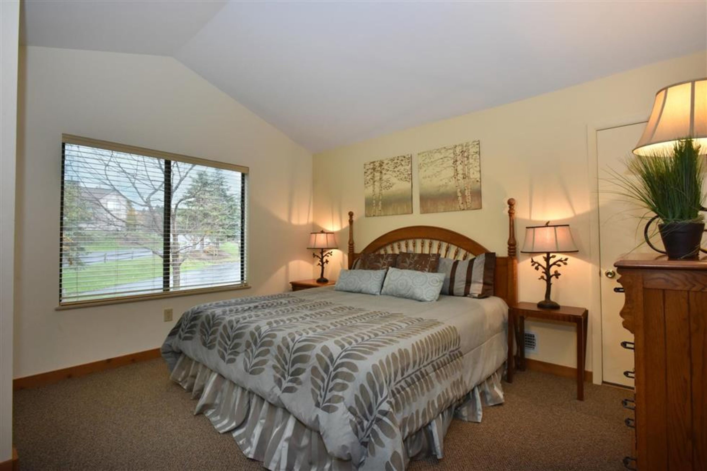 image Peaceful bedroom featuring a king bed, fresh linens, and ample natural light for restful mornings.