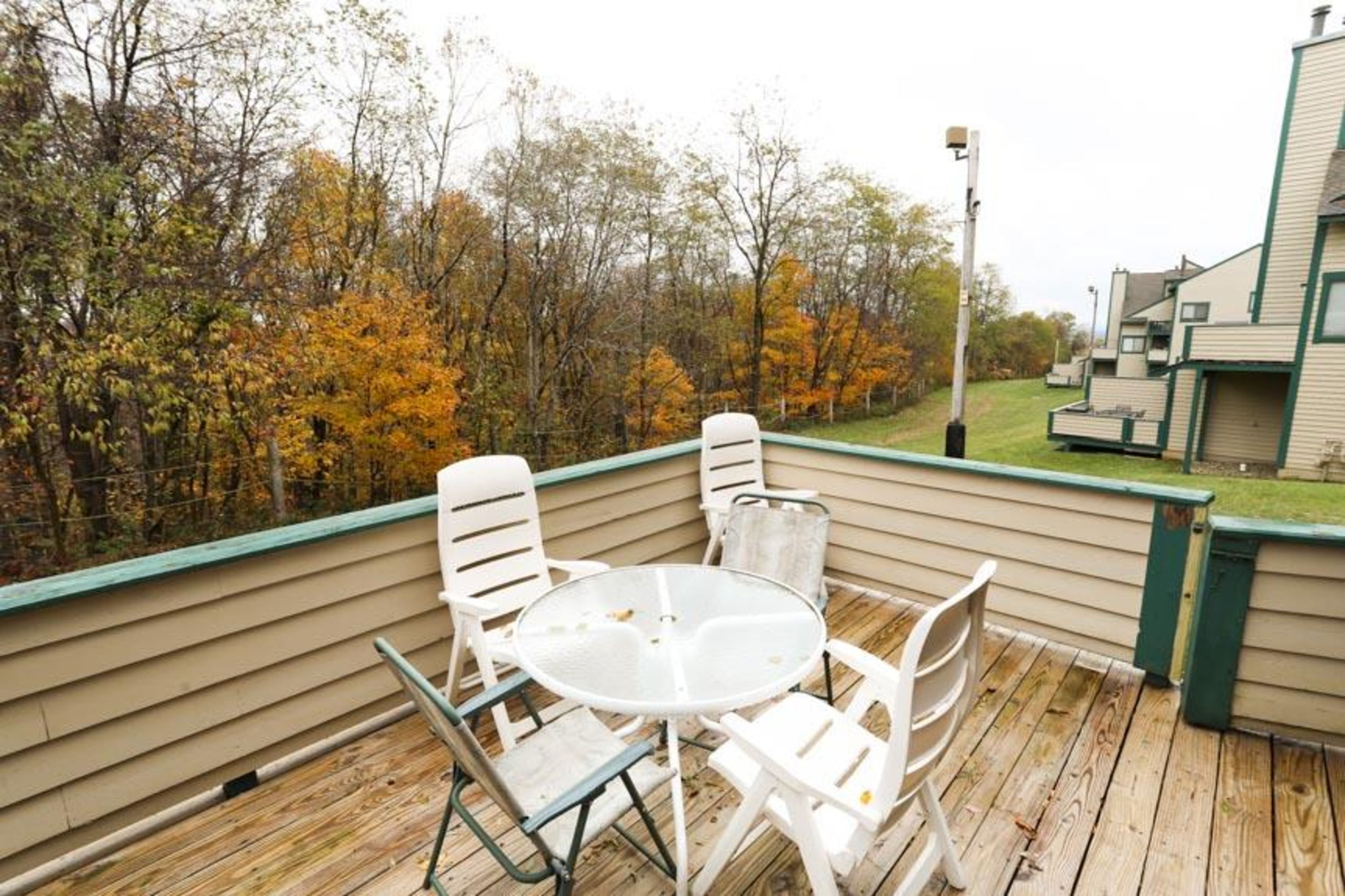 image Private deck with table seating and sweeping mountain views, perfect for morning coffee or après-ski drinks.