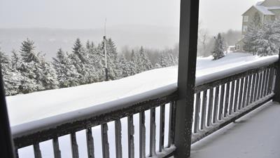 image Snow-kissed balcony/deck overlooking a winter wonderland, where stillness and beauty meet in the heart of the mountains.