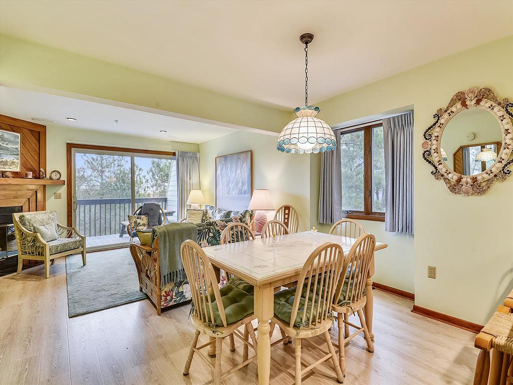 image Bright dining area that flows into the living space, ideal for gathering after a day on the beach.