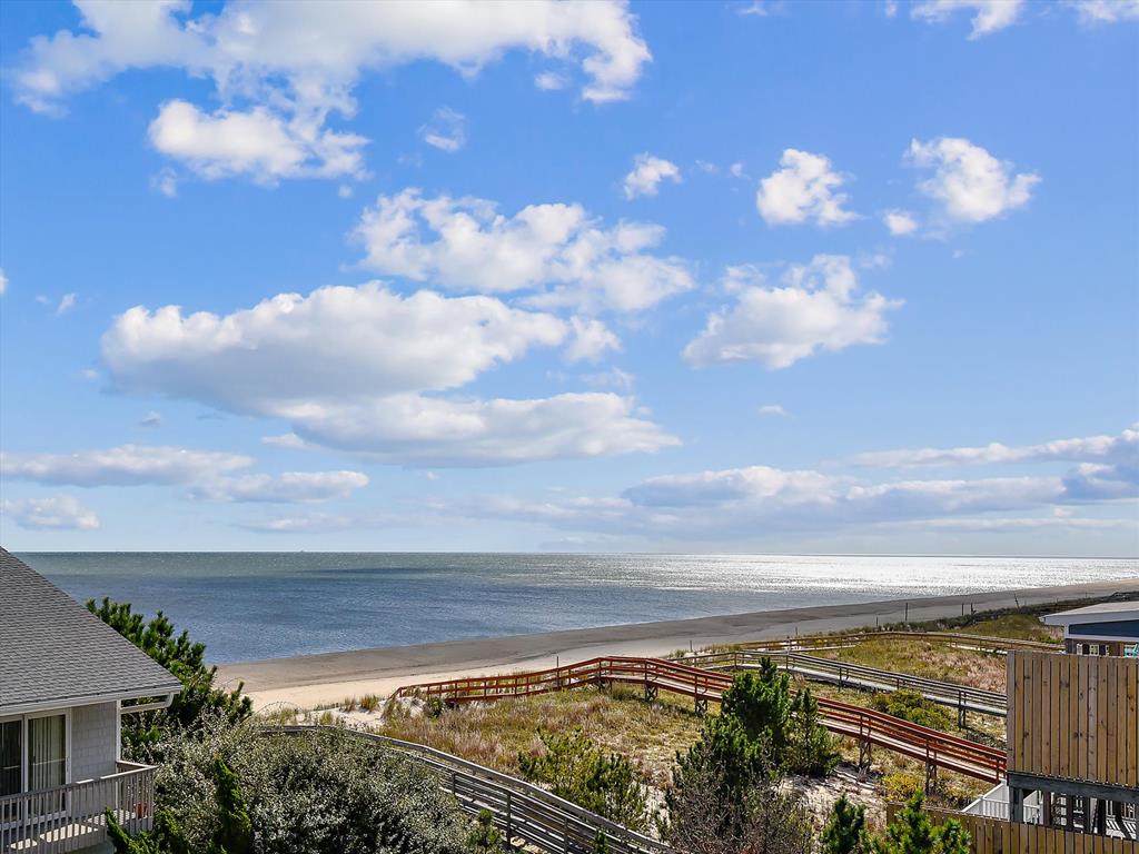 image Ocean and dune views stretch out in front of you, setting the scene for memorable beach days.