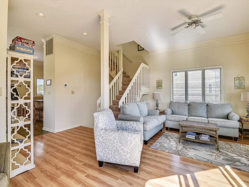 image Inviting main living room with coastal décor and room for everyone to unwind together.