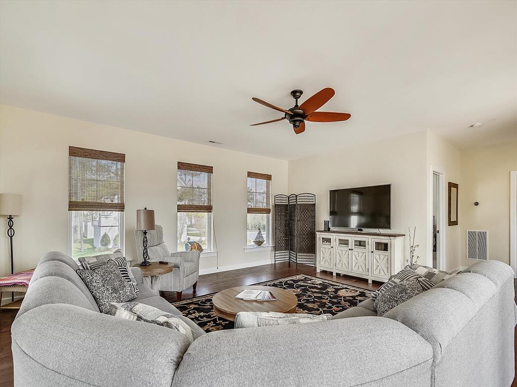 image Sprawl out in this inviting living room featuring cozy seating and a stylish design.