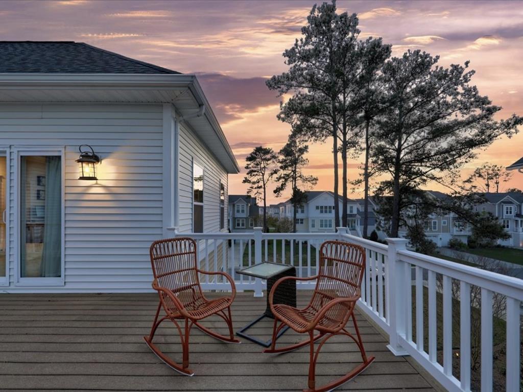 image Enjoy the evening light on the deck, where cozy seating awaits you for peaceful moments.