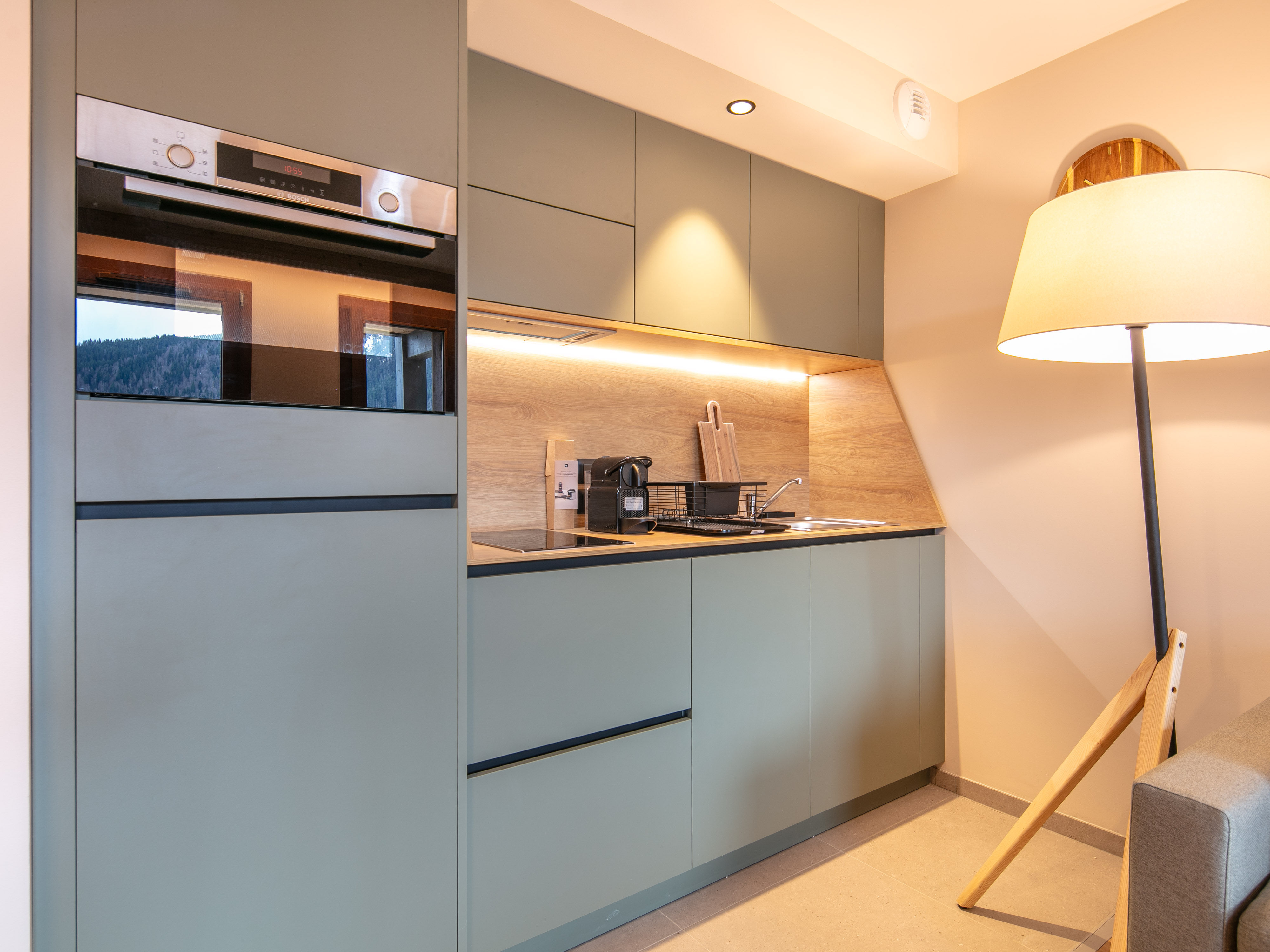 image Cook in style with a well-equipped kitchenette, blending modern design with functionality.