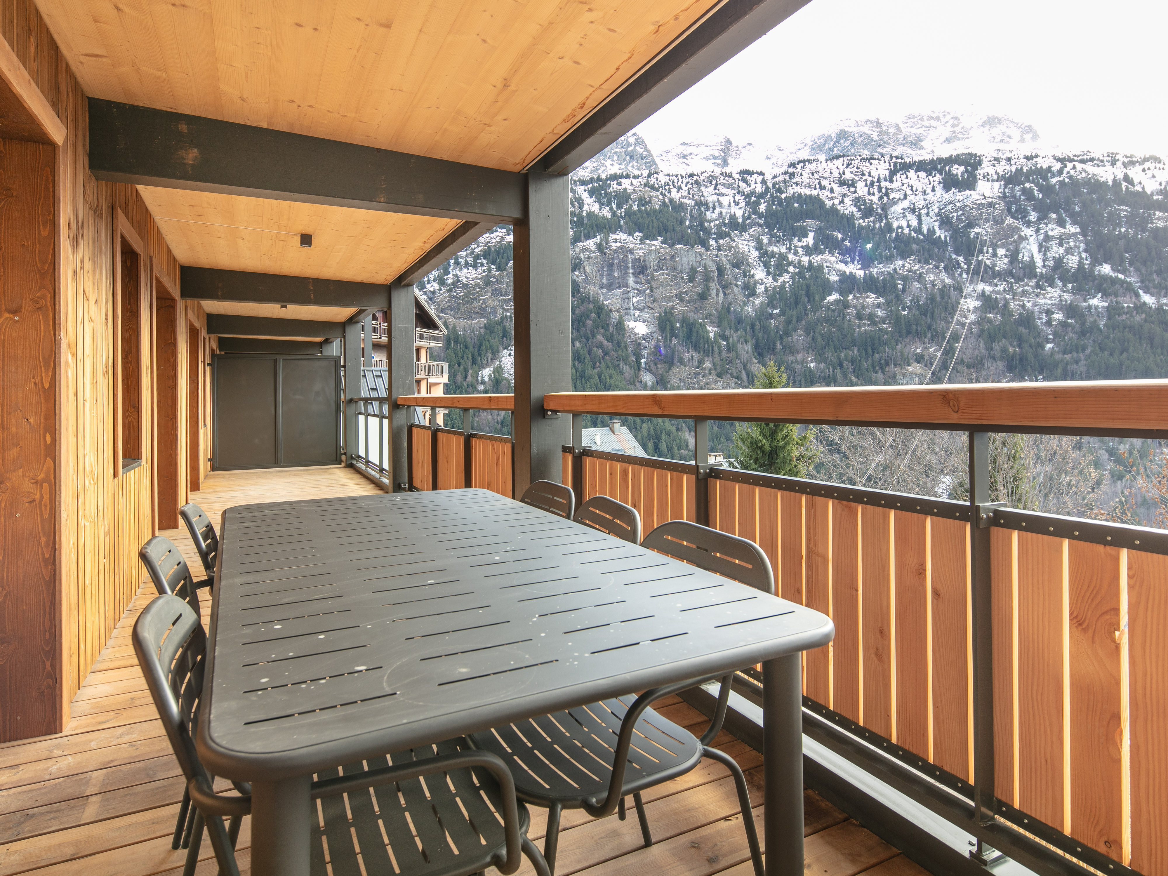 image Dine al fresco on a spacious terrace, surrounded by the beauty of the mountains.