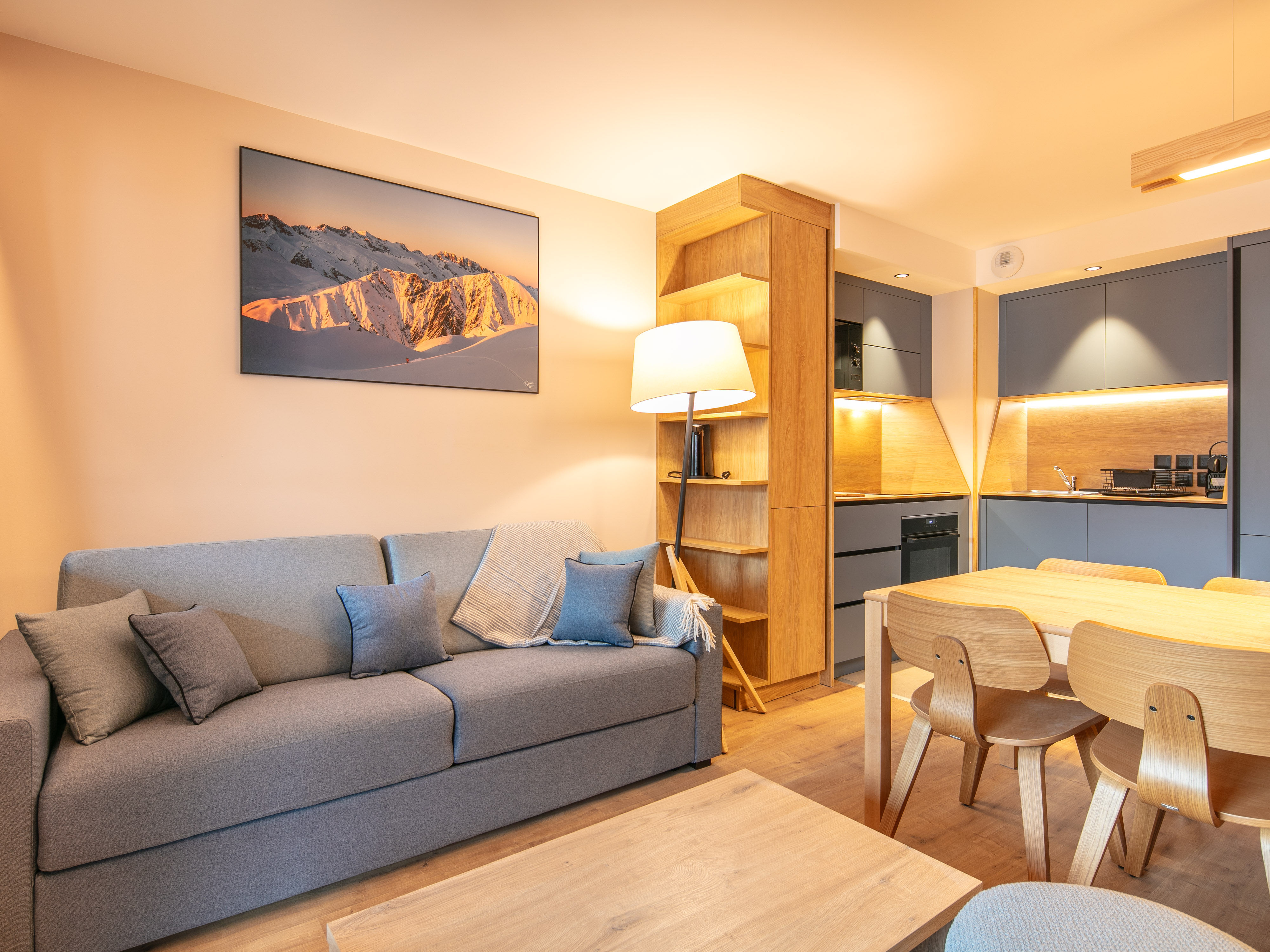 image Relax in the inviting living space, complete with plush seating and a well-equipped kitchenette.