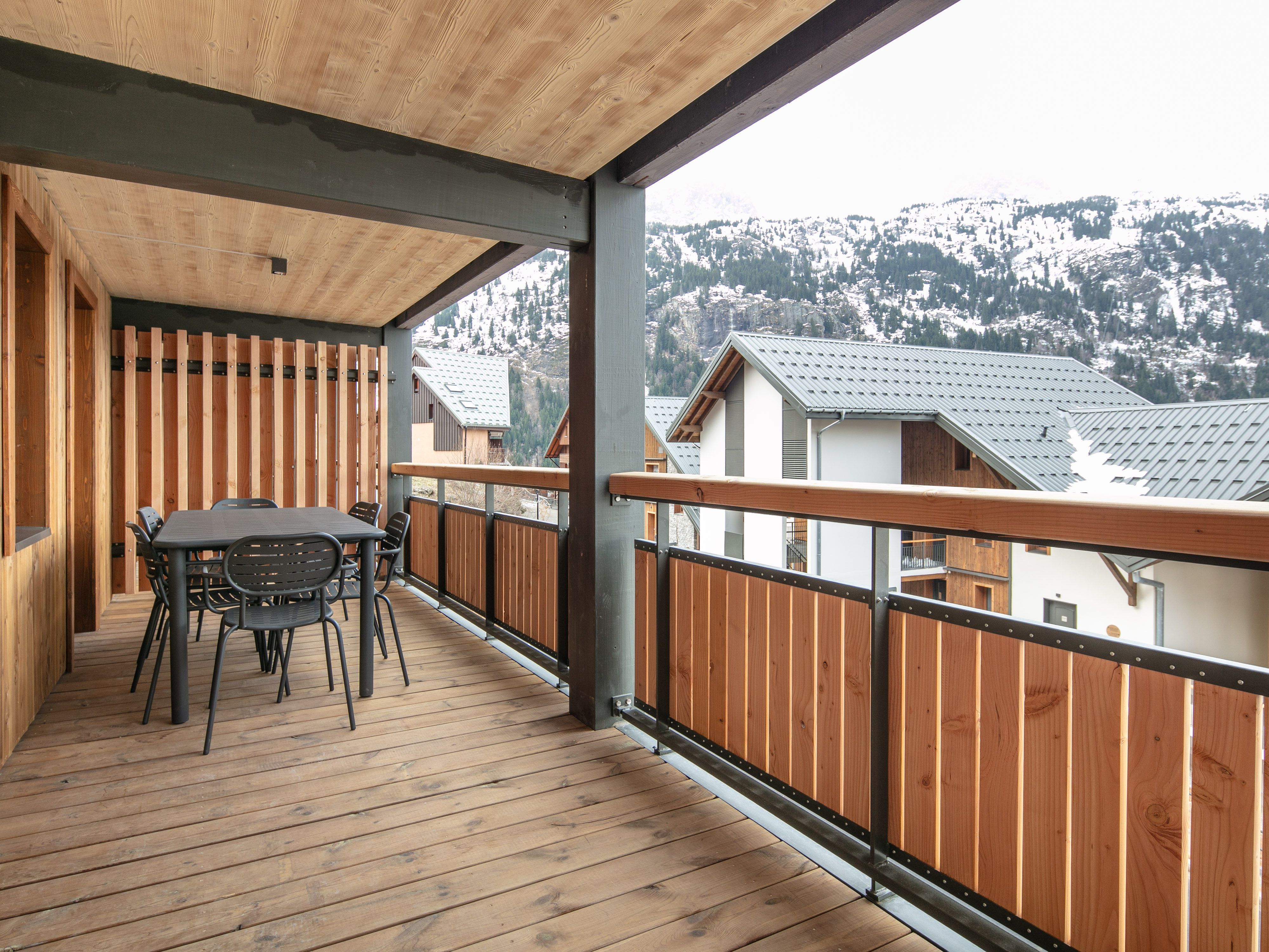 image Enjoy al fresco dining on the spacious terrace, surrounded by the tranquil alpine architecture and fresh mountain air.