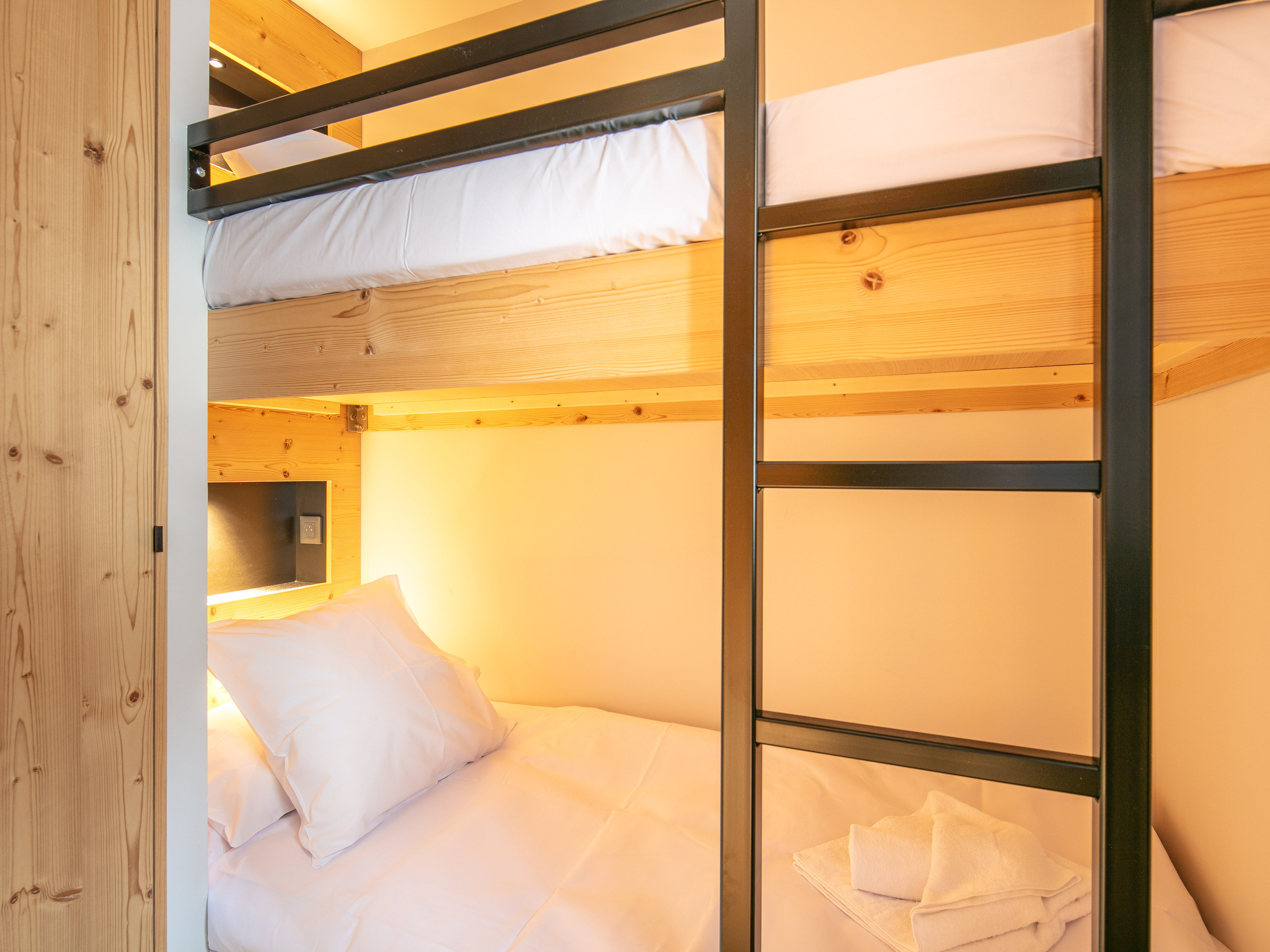 image Cozy up in this charming bunk bed area, perfect for restful nights and playful days.