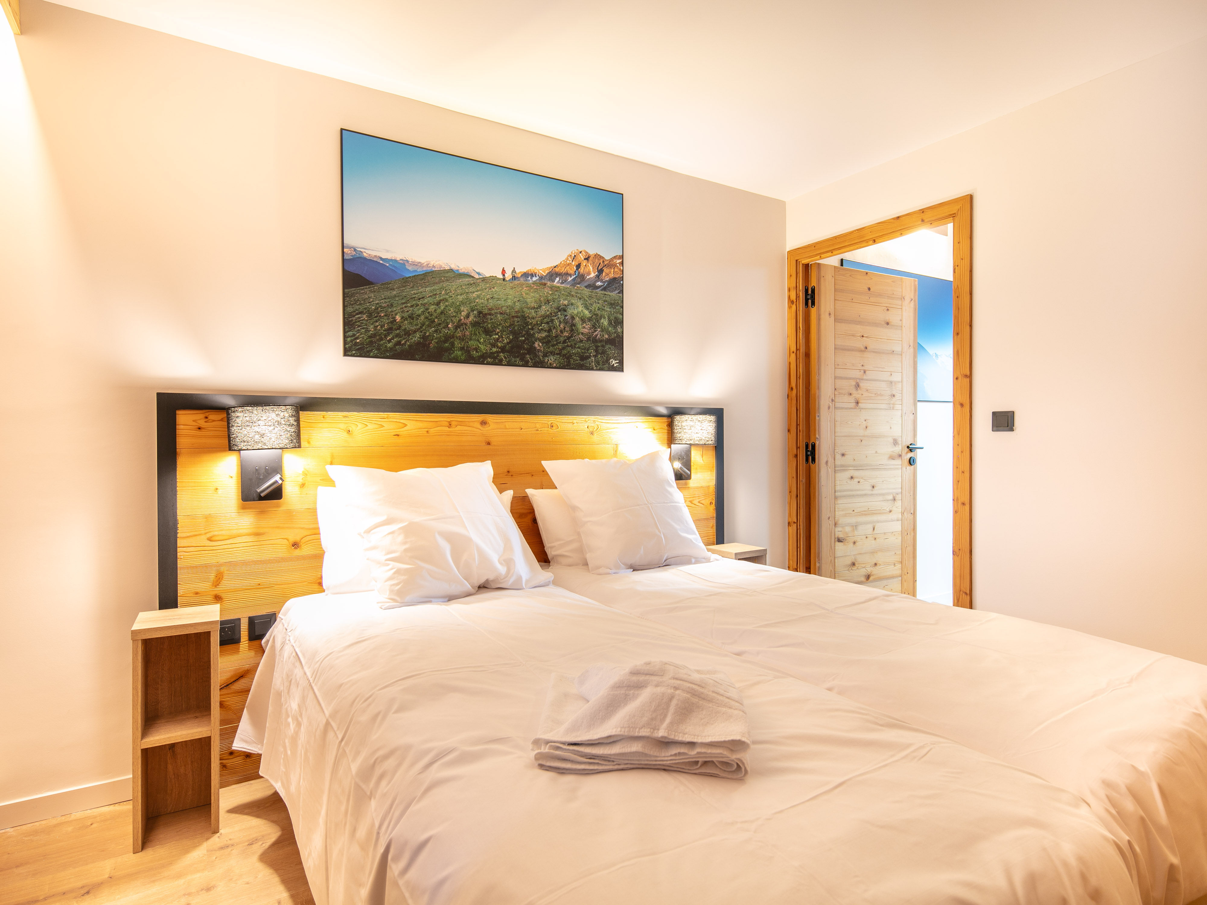 image Unwind in a stylish bedroom designed for comfort, complete with modern decor and warm ambiance.