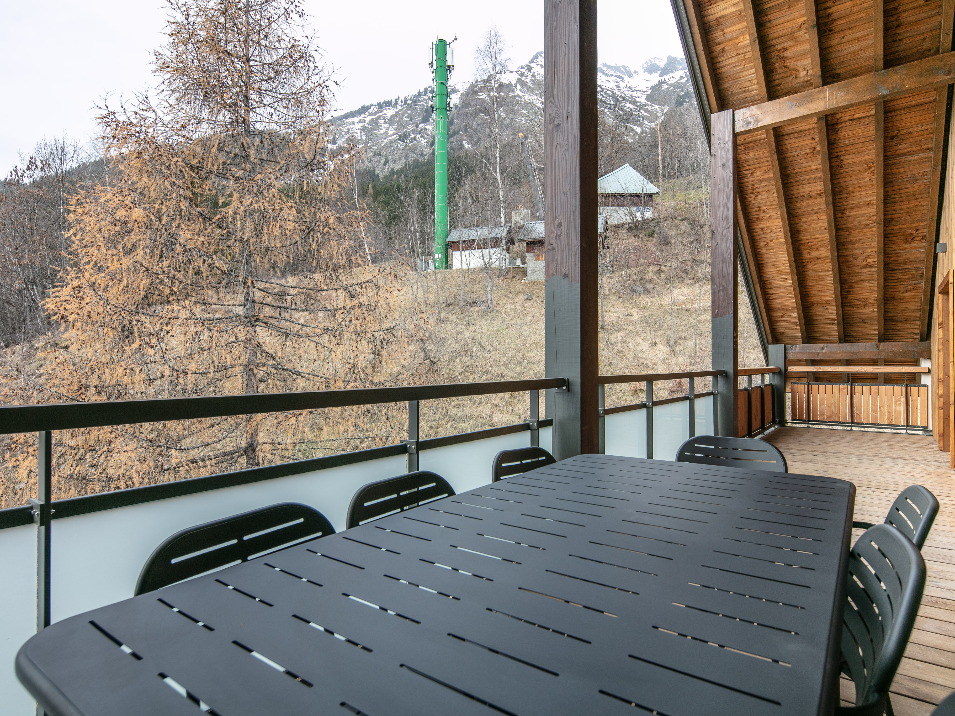 image Enjoy outdoor dining on the spacious terrace, surrounded by a tranquil alpine setting.