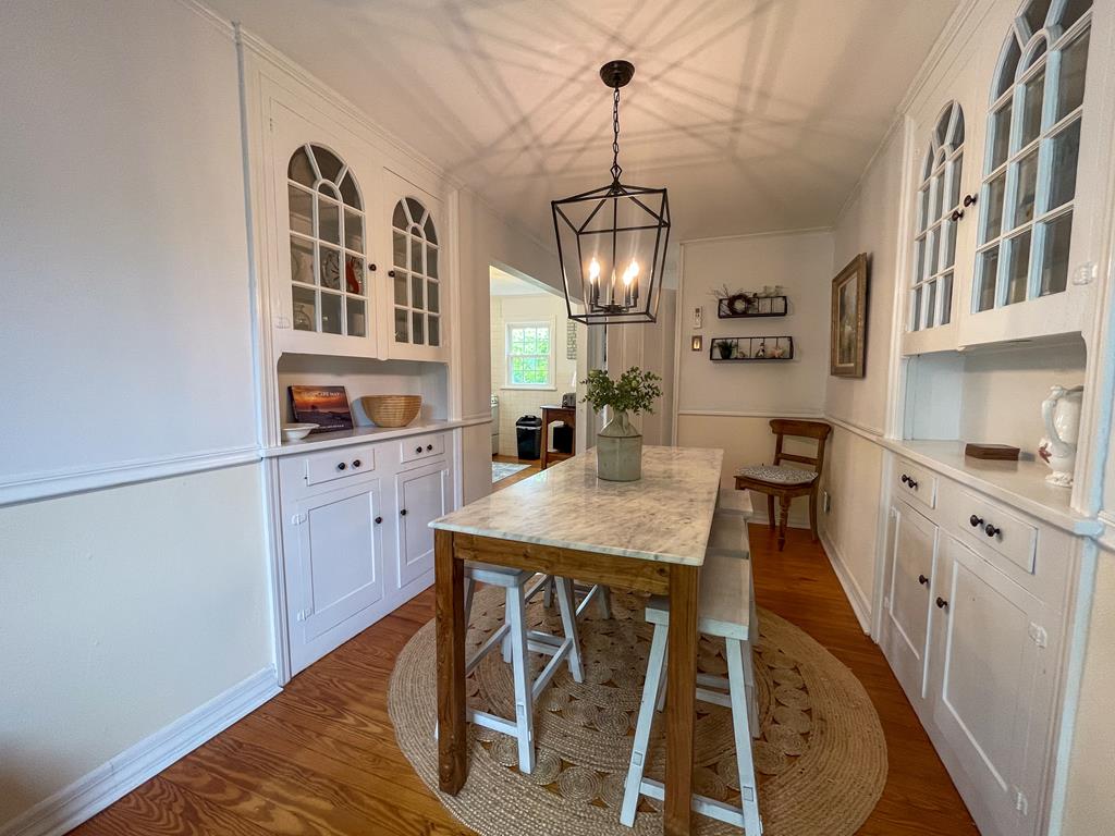 image The dining nook’s built-in cabinetry and soft lighting evoke timeless Cape May character — a space that feels like home from the first meal.