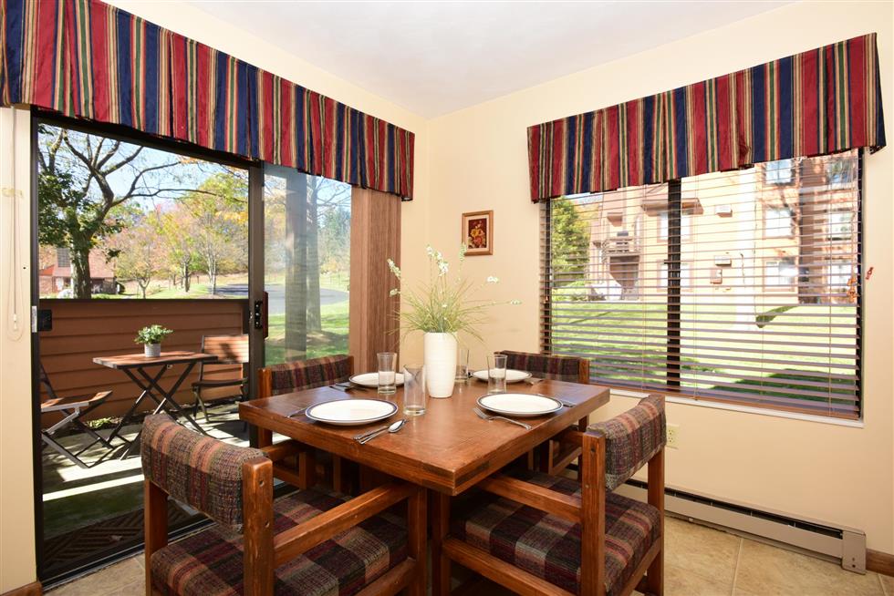 image Sunny dining area with scenic views, ideal for lingering over breakfast or planning your day’s activities.