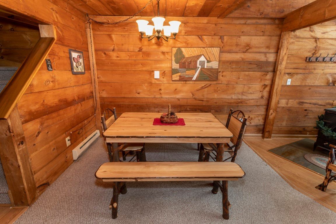 image Dining area with rustic charm, where everyone can gather for meals or late-night board games.