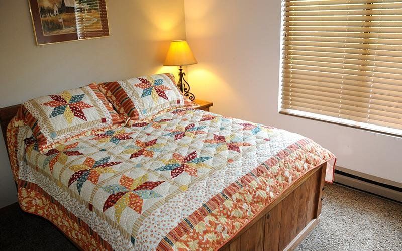 image Restful bedroom with a plush bed and soft lighting promises peaceful nights and gentle mornings.