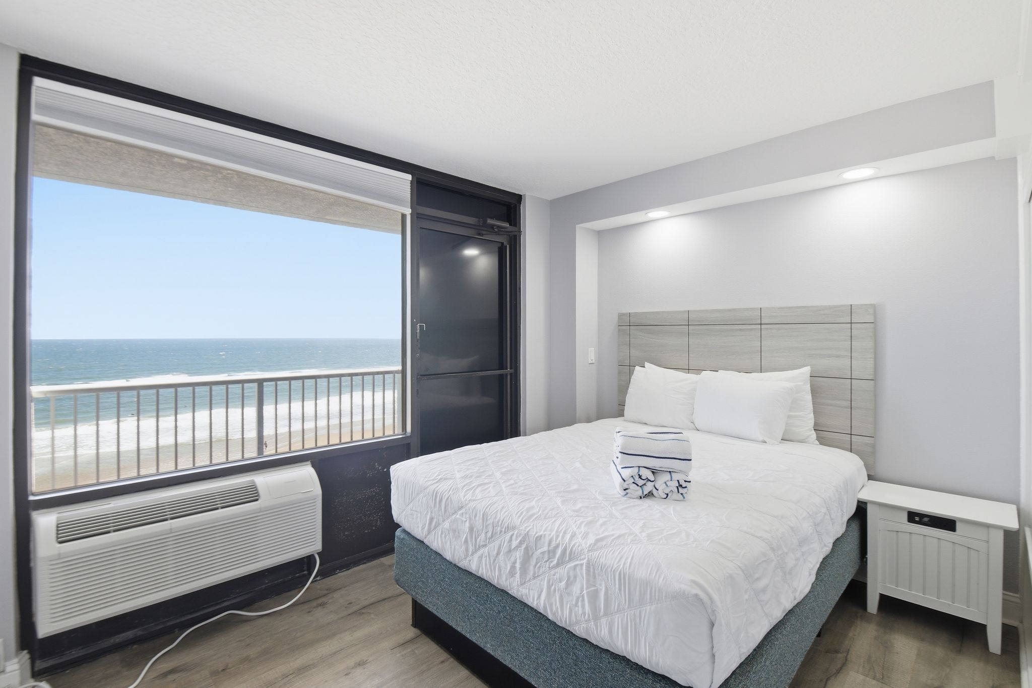 image Wake up to stunning ocean vistas from this plush sleeping space, designed for tranquility with soft linens and natural light bathing the space.