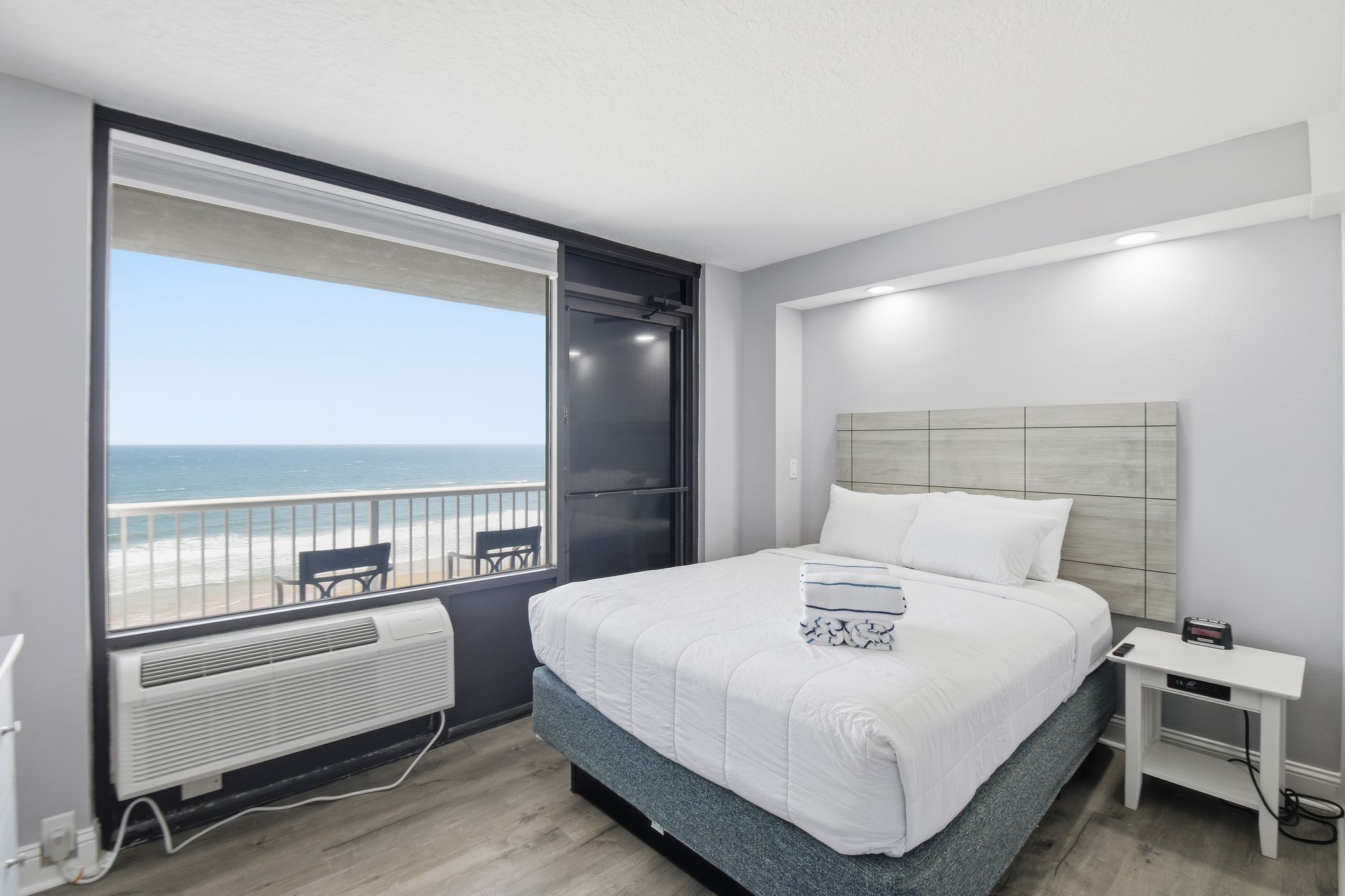 image This inviting sleeping space features a plush queen bed with crisp linens, offering oceanfront views that promise restful nights and serene mornings with the soothing sounds of the sea.