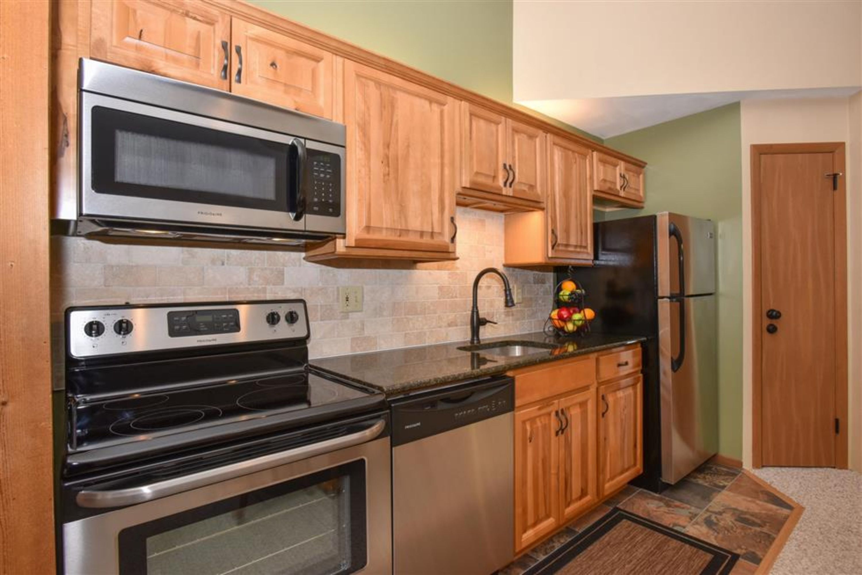 image Sleek kitchen with stainless steel appliances, perfect for cooking up cozy meals between adventures.