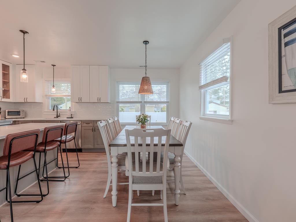 image Cook, chat, and connect — this modern kitchen with breakfast island is made for family moments.