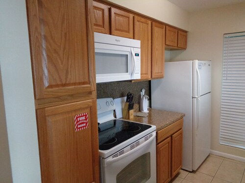 image Bright kitchen with a welcoming vibe, where the rhythm of island living begins each morning.