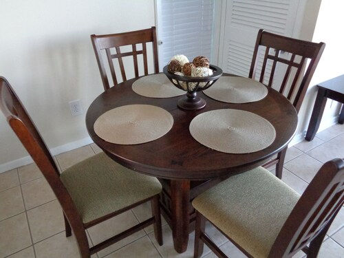 image Cozy dining area set for intimate meals, surrounded by soft tones that make every gathering feel special.