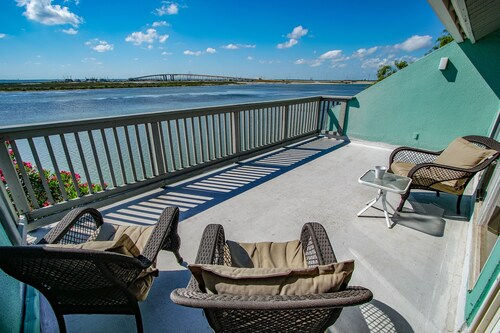 image Expansive balcony overlooking the peaceful bay, where mornings begin with golden light and evenings fade into soft coastal hues.