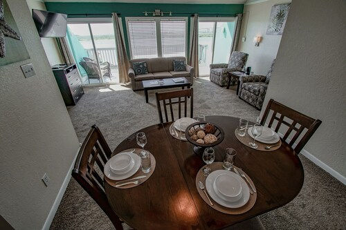 image Bright dining space where sunlight pours in, setting the stage for slow breakfasts or cozy dinners after a day by the water.