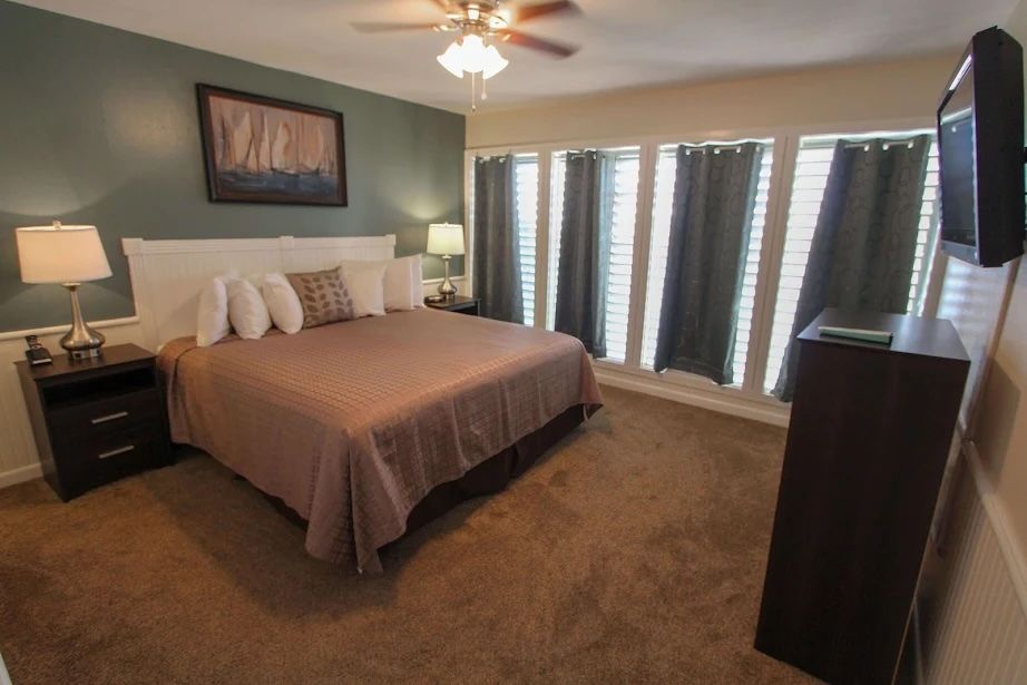 image Peaceful master retreat wrapped in soft tones and quiet charm, inviting slow mornings and restful evenings.