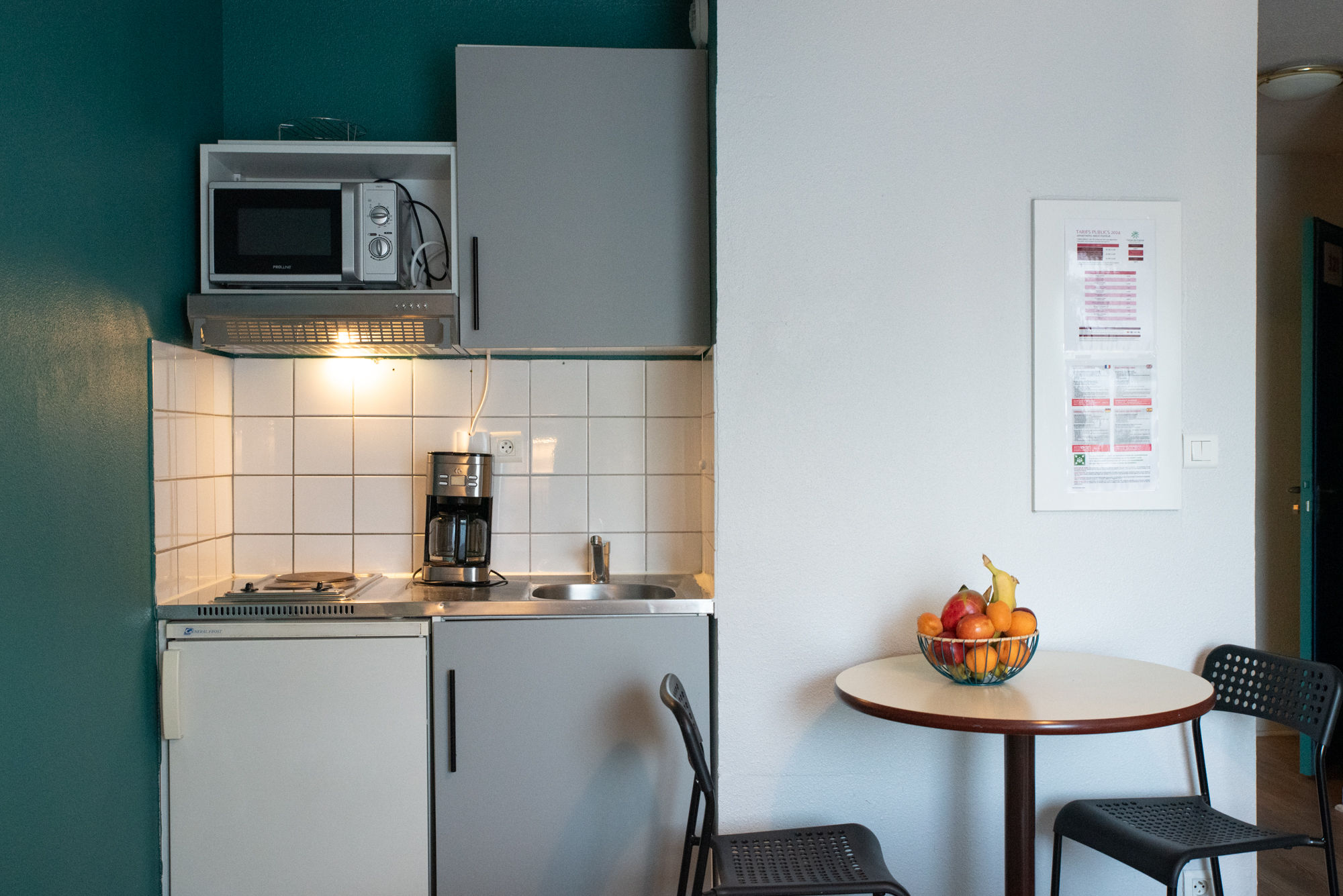 image The compact kitchenette provides a convenient setup for preparing simple meals.