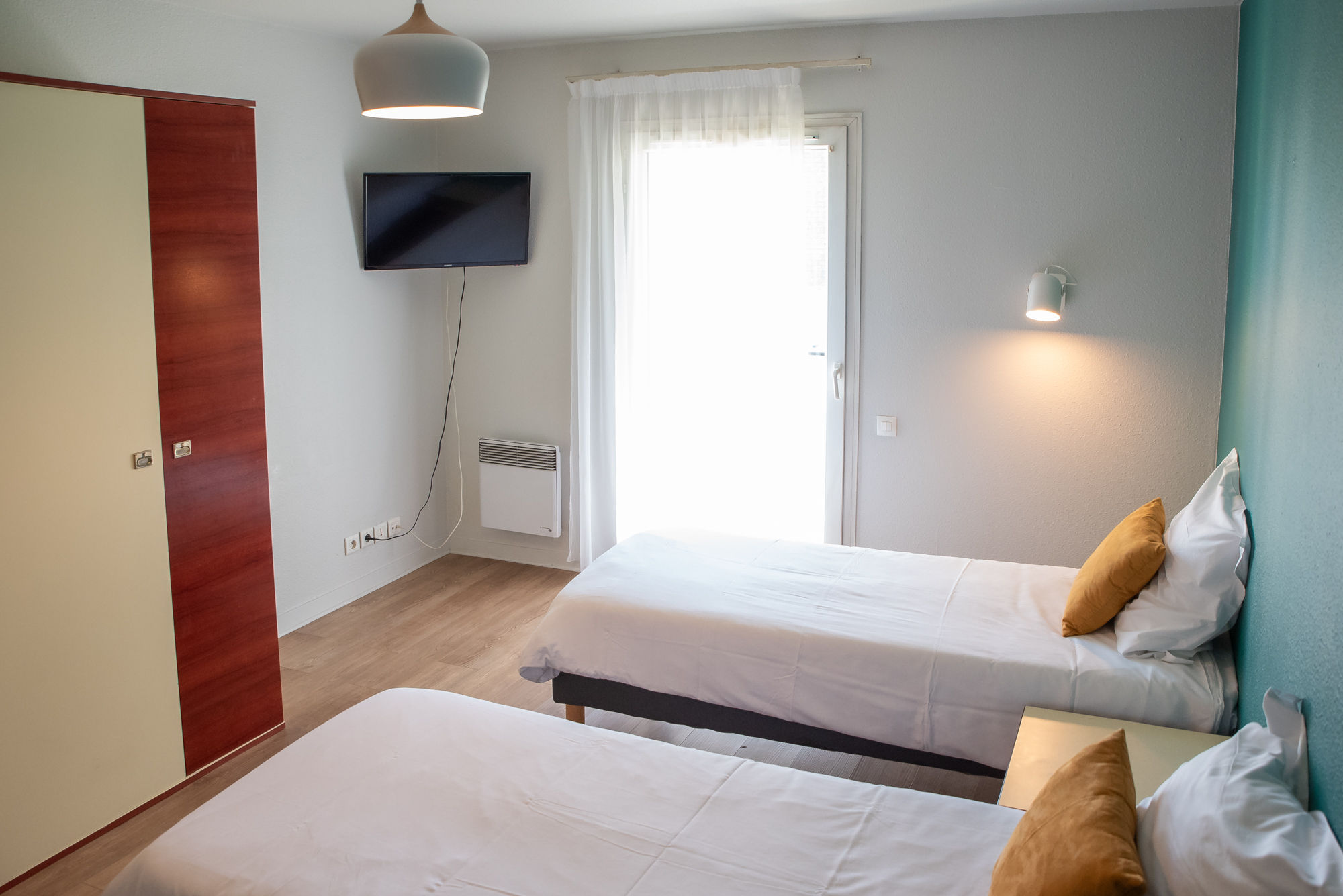 image The sleeping area opens toward the balcony, bringing in natural light and an airy feel.