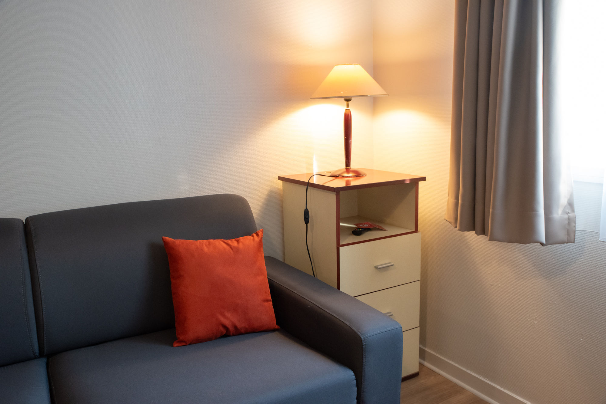 image A cozy seating area offers a pleasant spot to unwind during your stay.