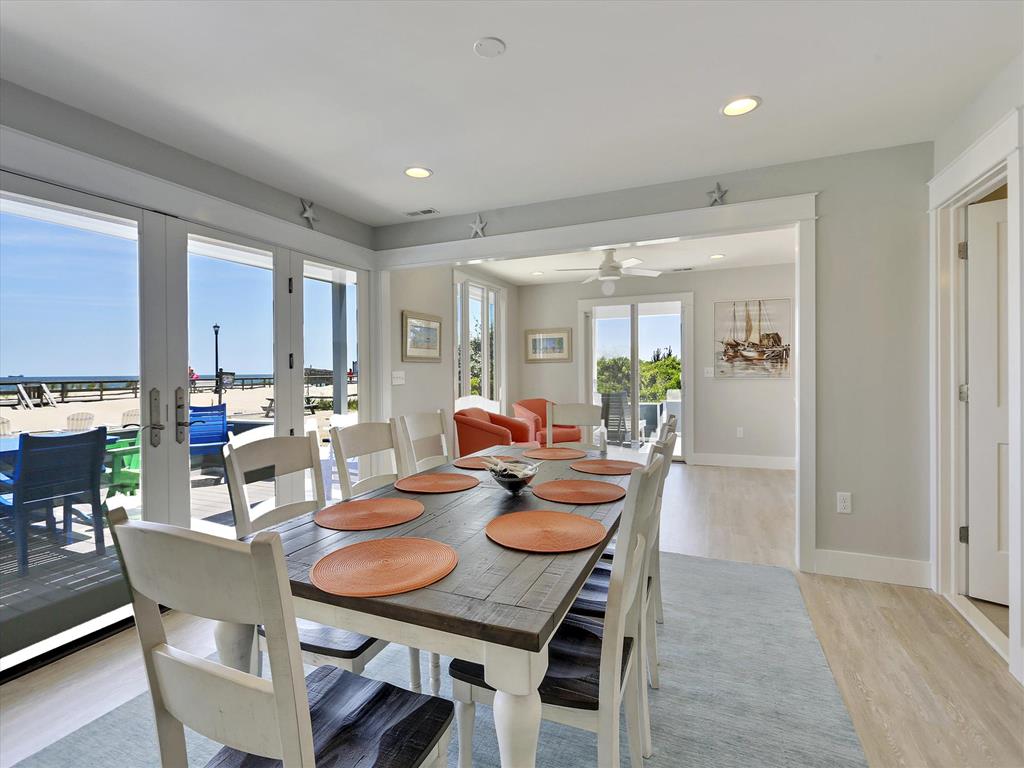 image Gather around the large dining table as you savor delicious meals and create cherished memories with loved ones.