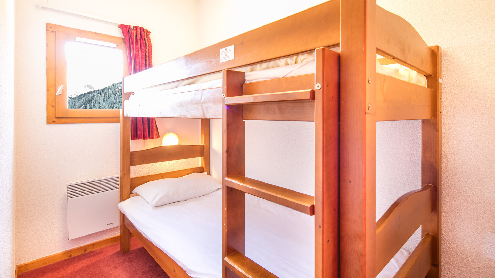 image Fun bunk bed area ideal for children or friends — a cozy mountain nook for a good night’s sleep.