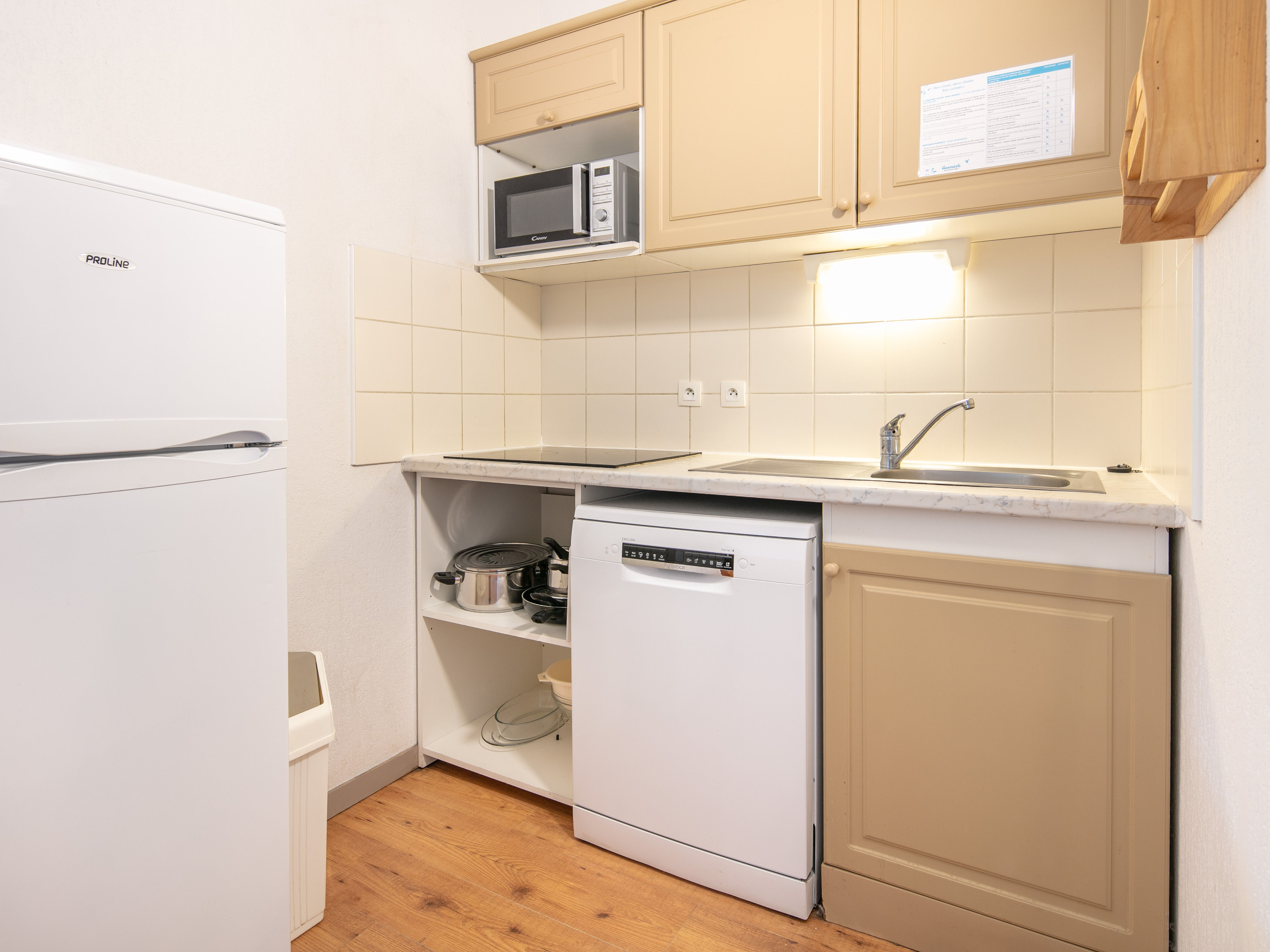 image Practical kitchenette with modern appliances, perfect for easy self-catering during your stay.