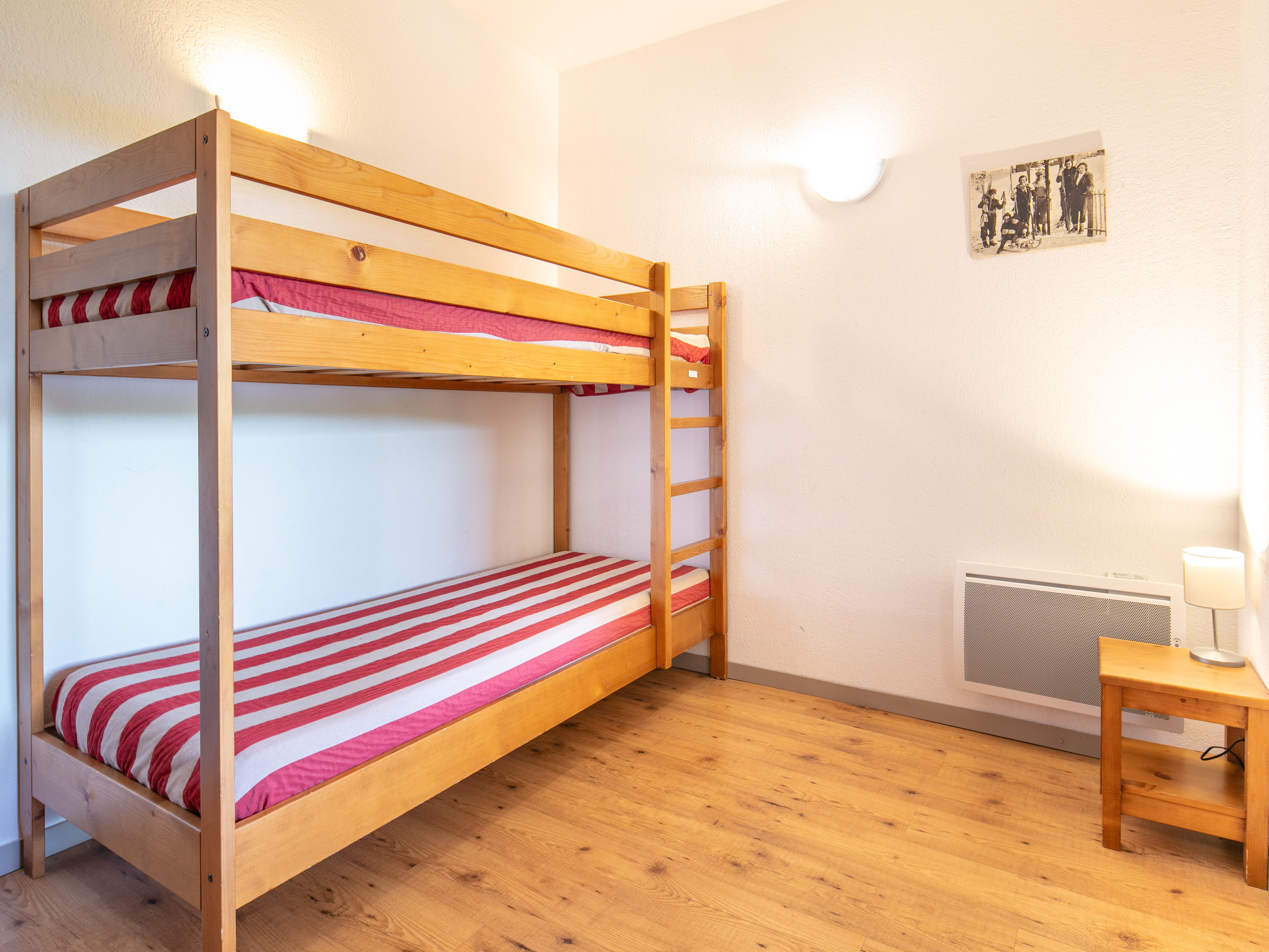image Charming bunk room with warm wooden décor, great for families or groups.