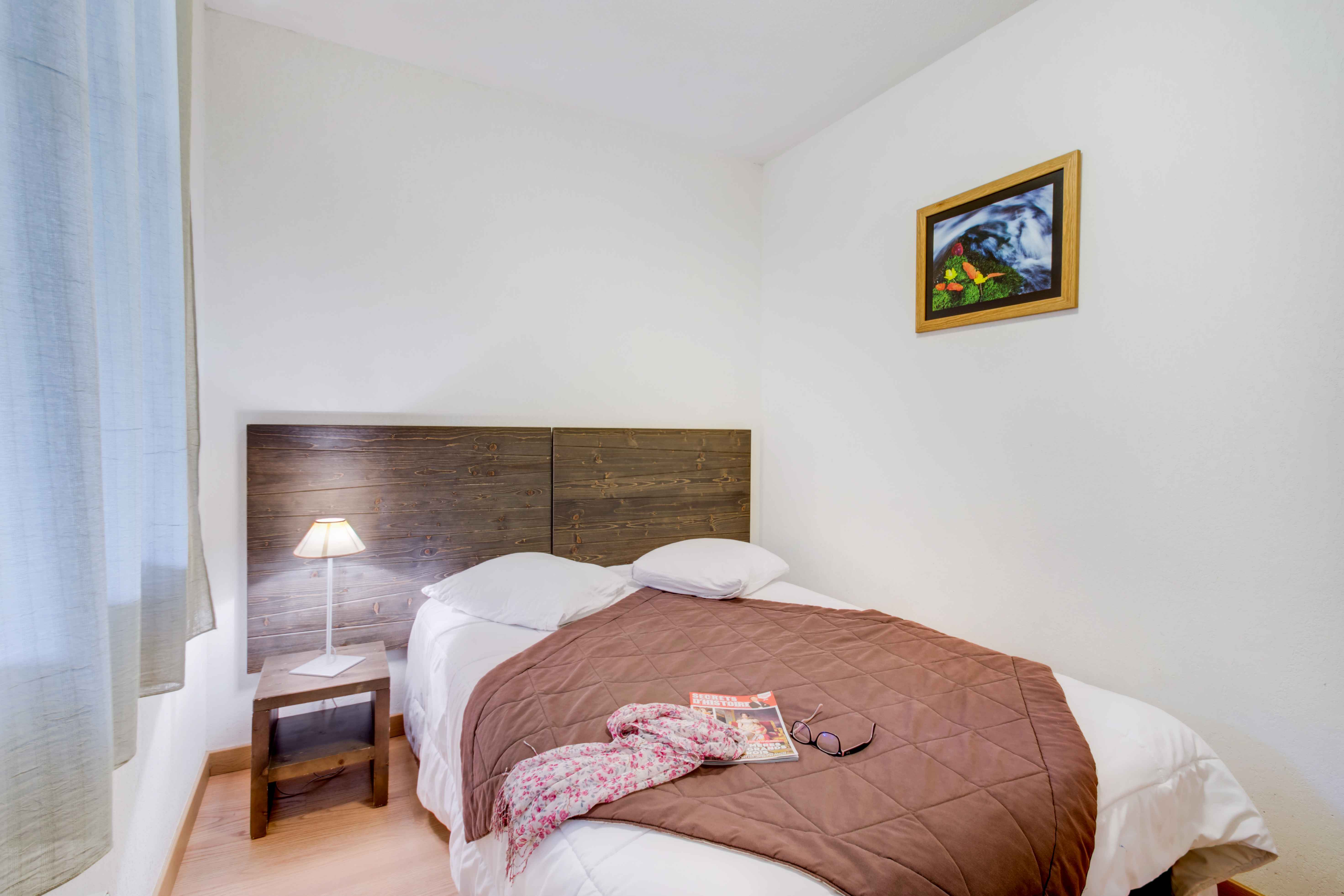 image Peaceful double bedroom with soft bedding and a warm, inviting décor — the perfect spot to unwind and rest.