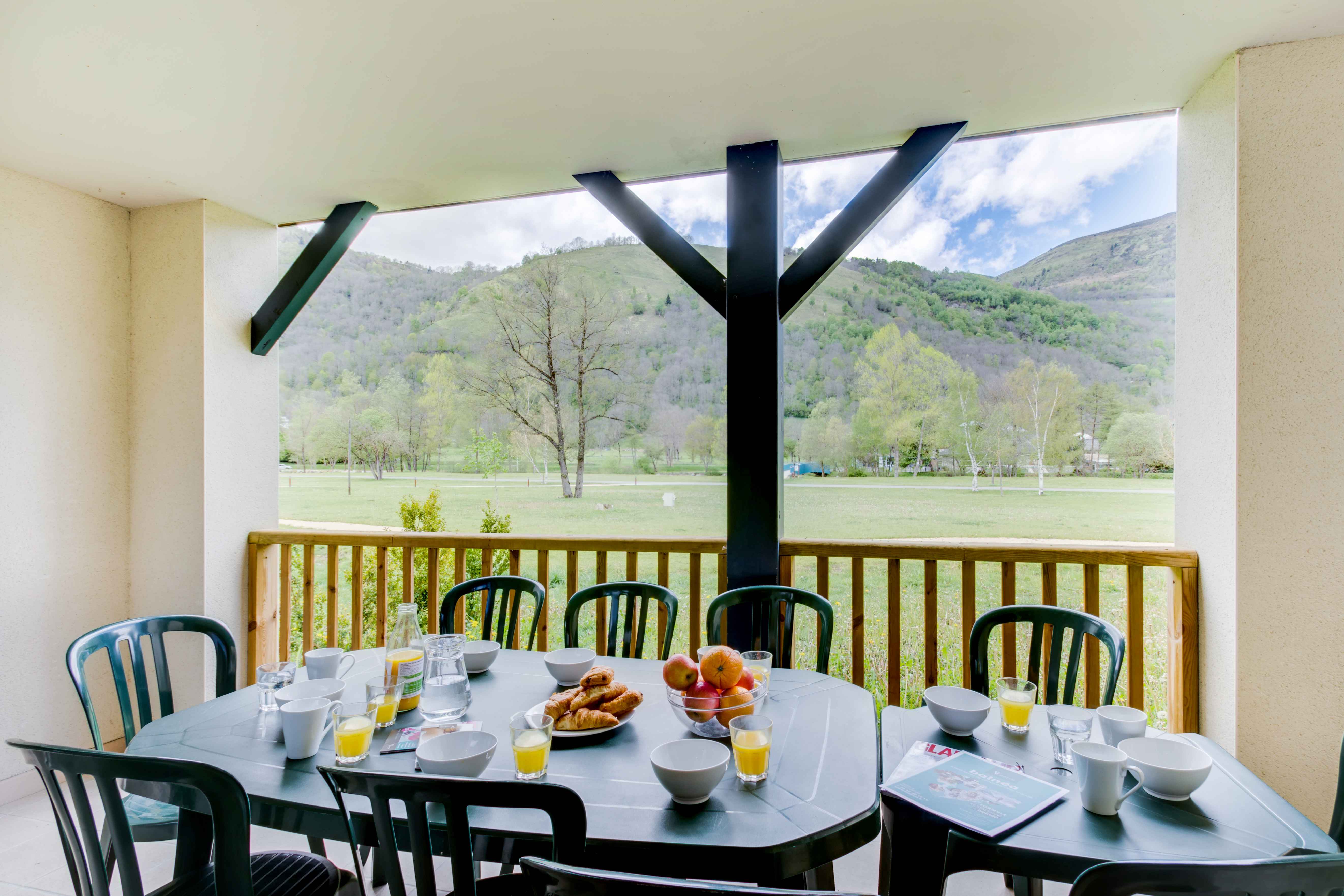 image Private balcony with outdoor dining and panoramic views of the Pyrenees — enjoy breakfast or evening drinks surrounded by nature.