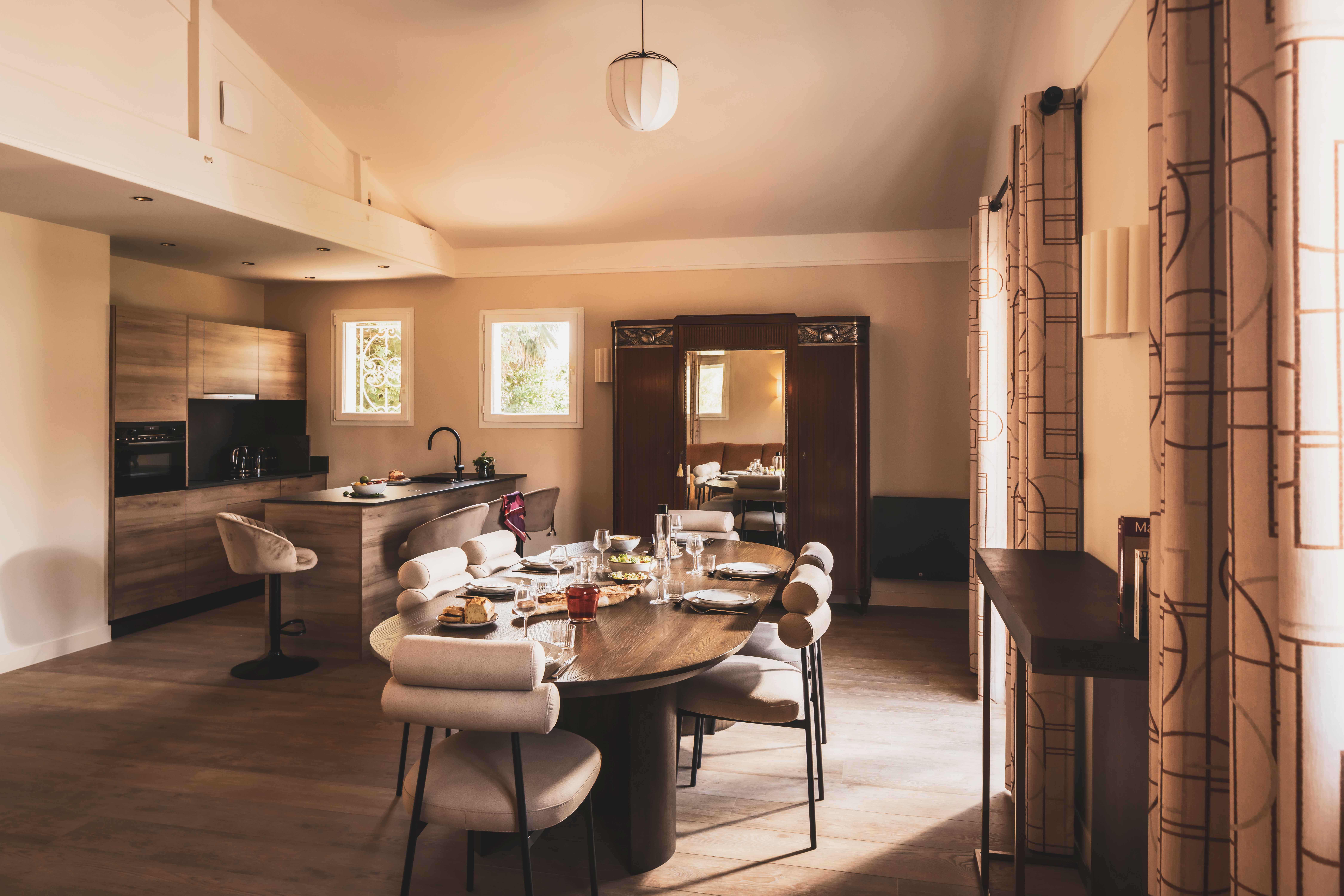 image An open-plan kitchen and dining area where modern design meets the cozy charm of a Basque home.