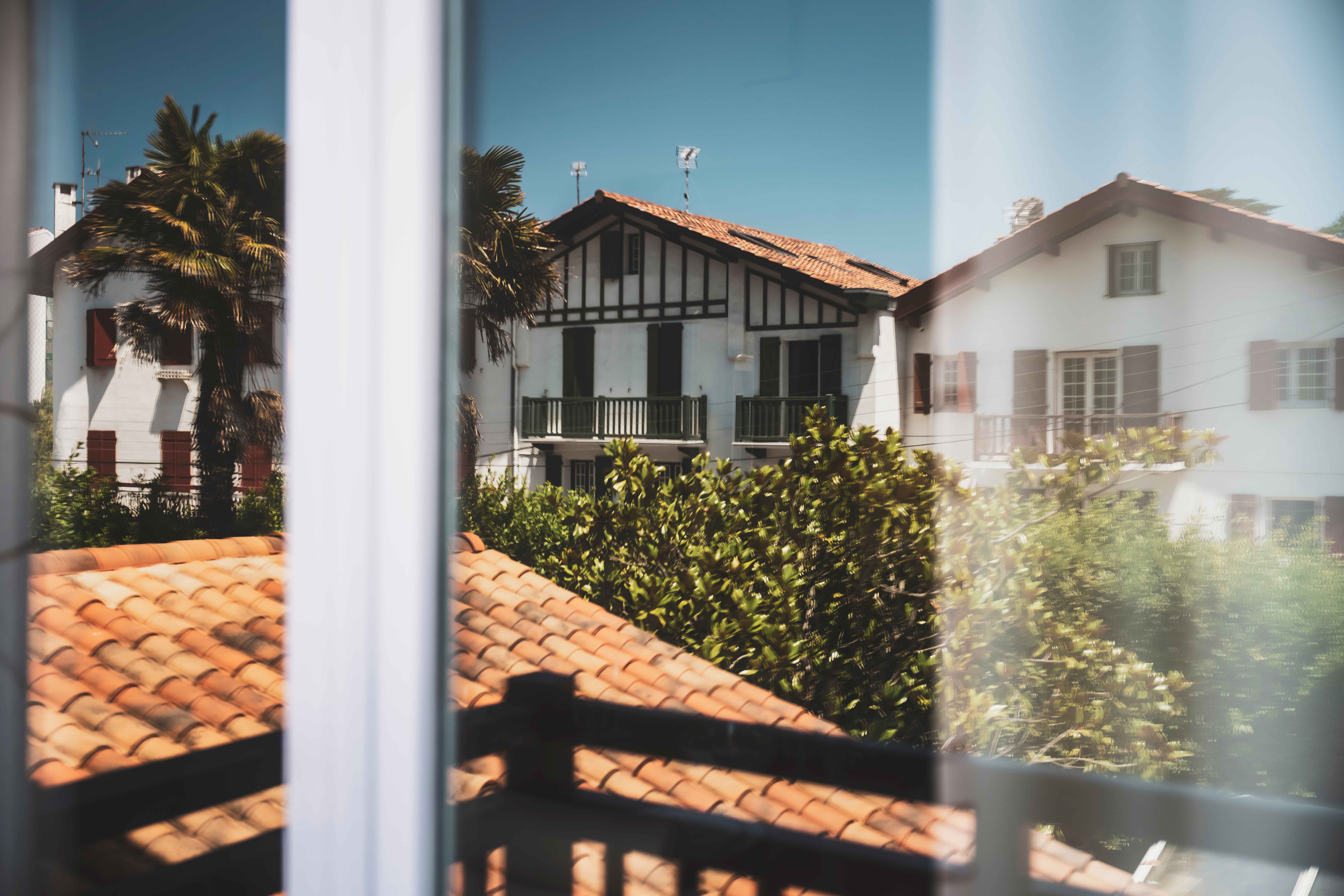 image Traditional Basque rooftops and sunlit facades — your authentic Saint-Jean-de-Luz view from the apartment.