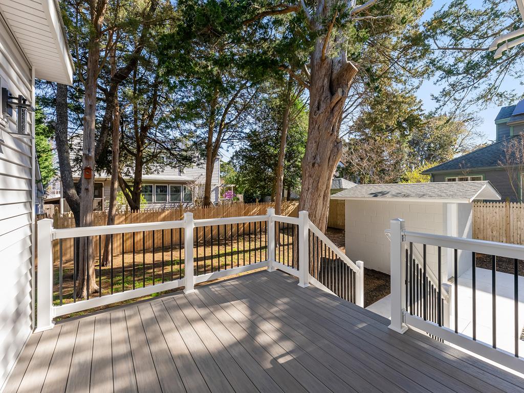 image Private back deck nestled among trees—perfect for morning coffee or evening cocktails.
