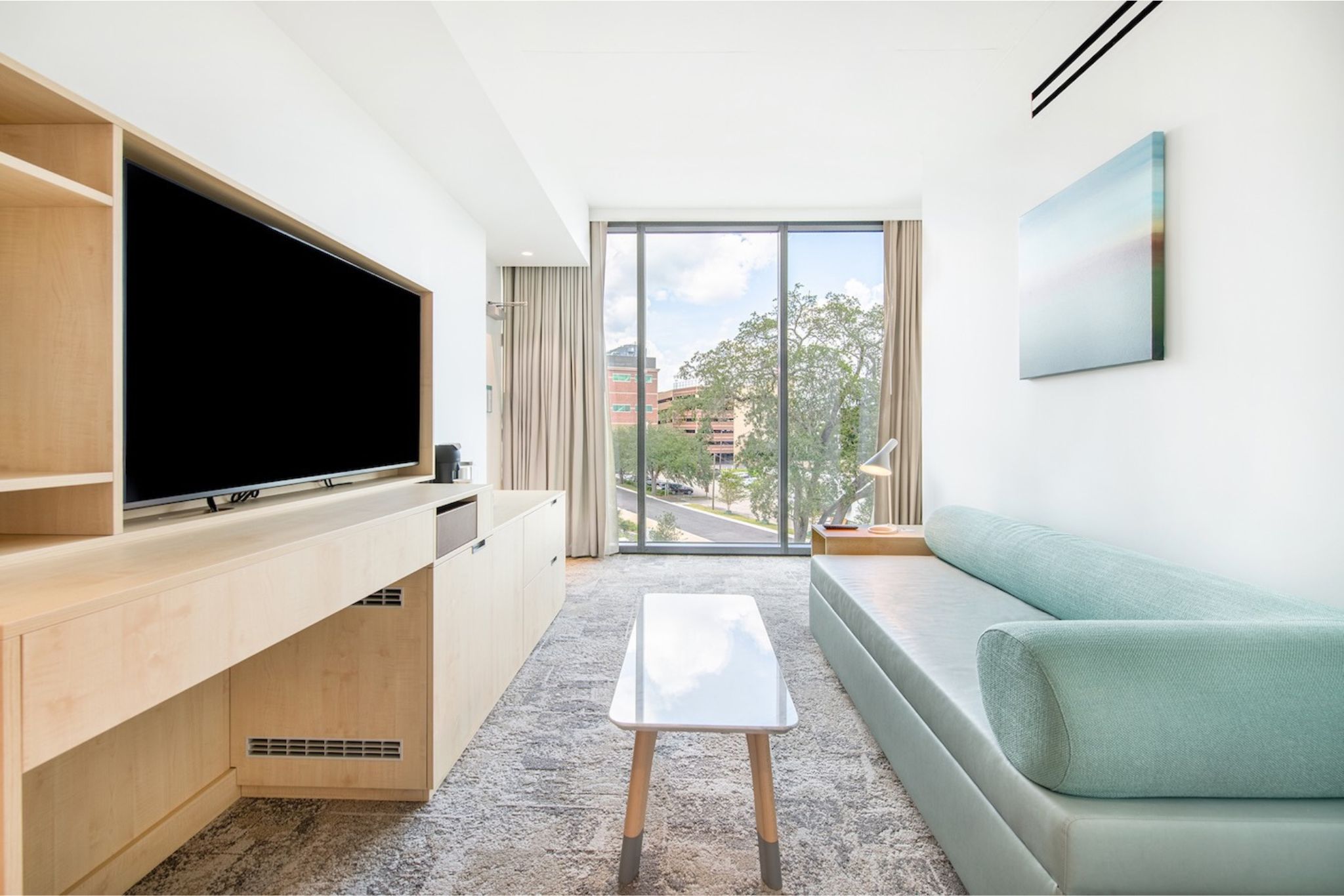 image Experience modern elegance at Hotel Eleo, where stunning city views and luxurious furnishings await just steps from the University of Florida campus.