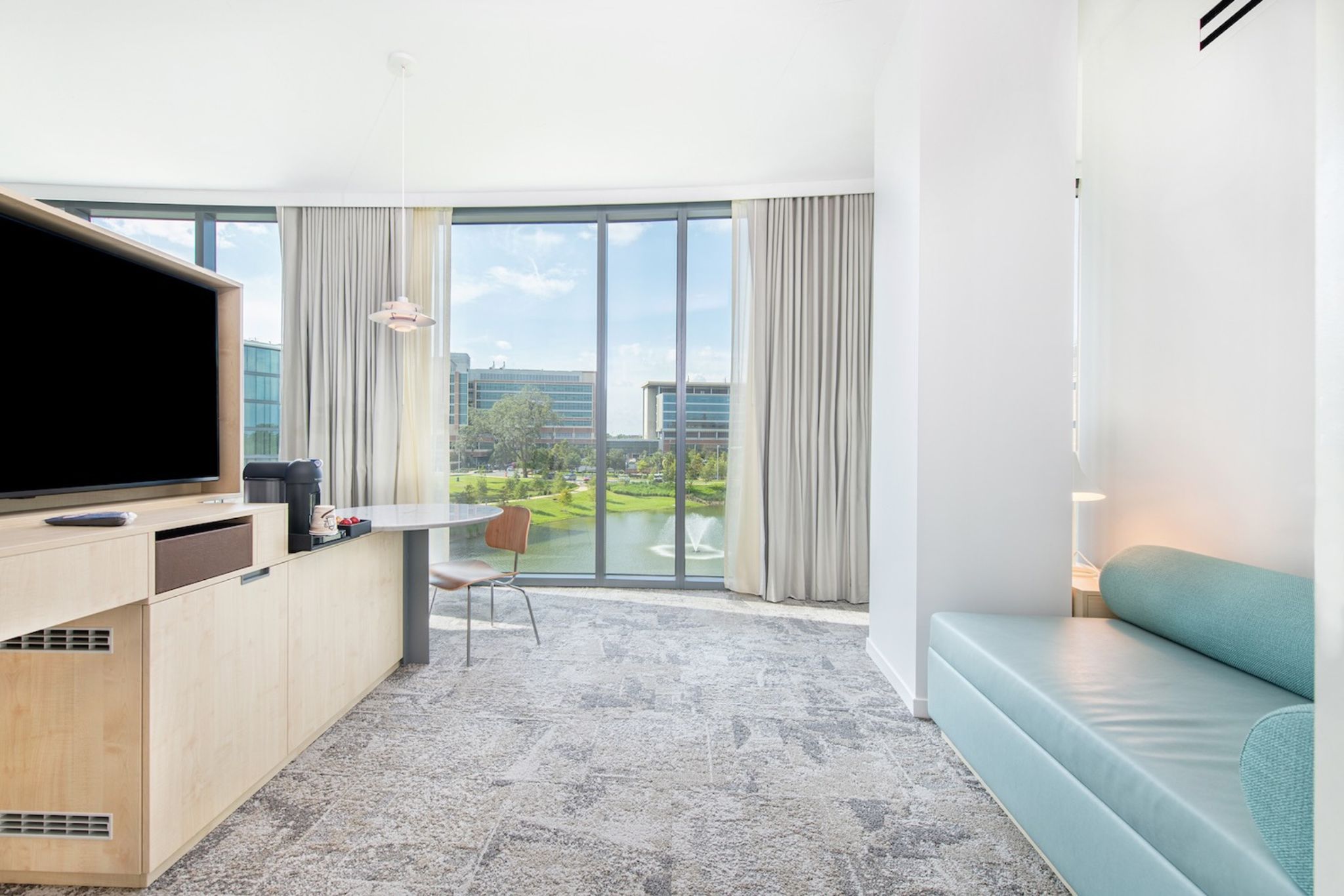 image Wake up to serene lakeside views in a modern oasis at Hotel Eleo.